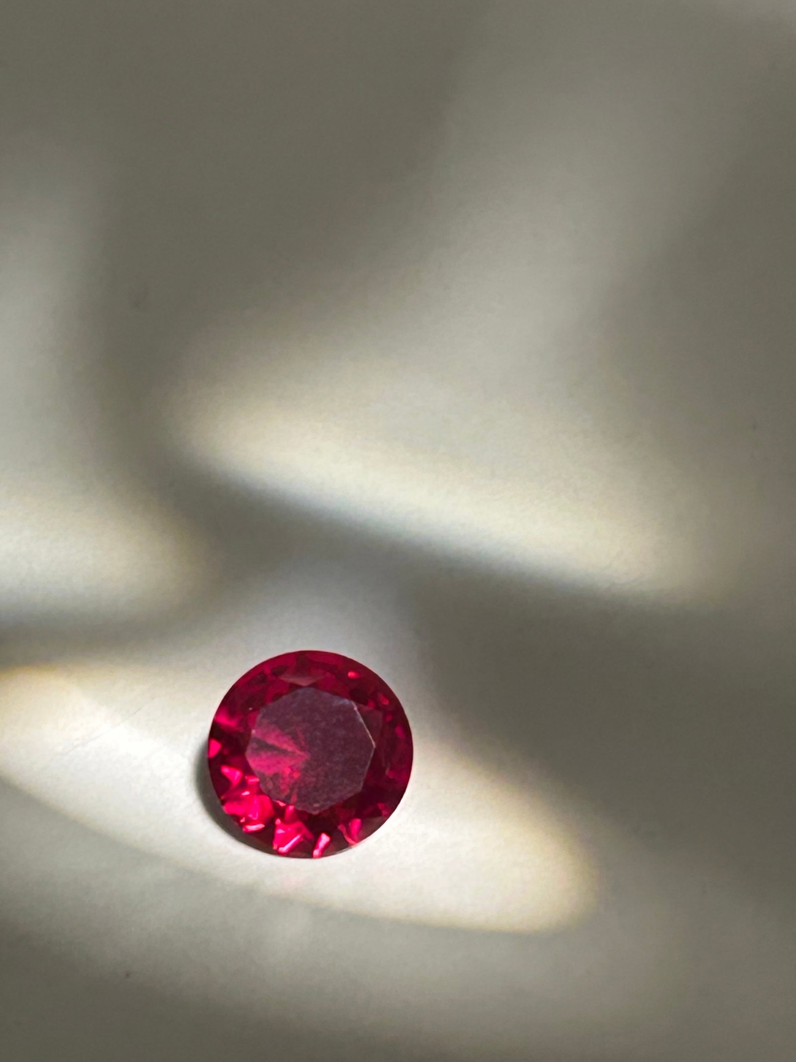 3.5 Carat --- Mozambique Red Ruby --- Round Cut: featuring a vivid, pure red hue with slight blue undertones that create intense saturation.