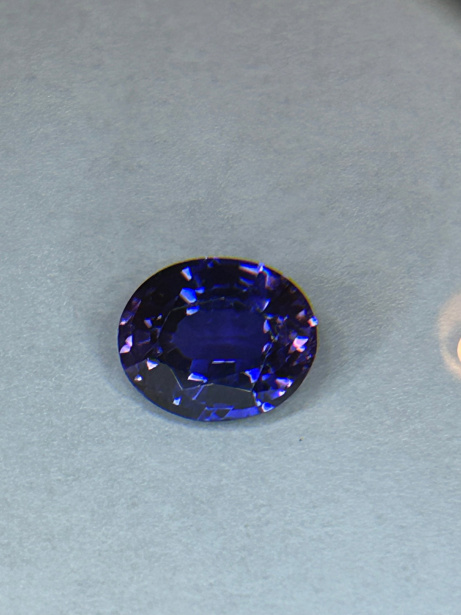 8.30 Carat Purple Tanzanite Oval Cut ASGL Certified: A large, high-carat, oval-cut loose gemstone, likely featuring intense violet-blue hues sourced exclusively from Tanzania. It boasts excellent cut, high brilliance, and is often certified, making it s