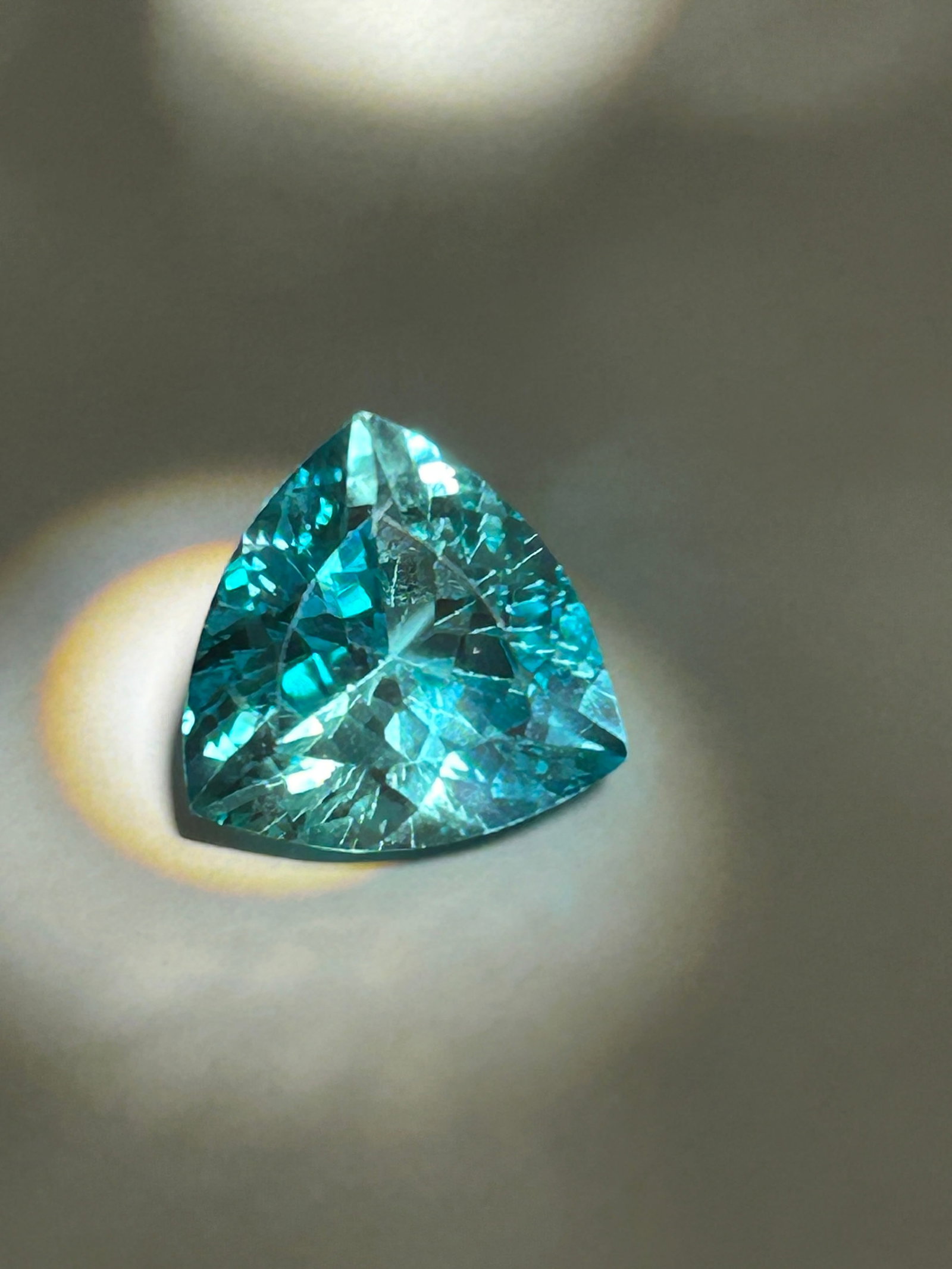 9.30 Carat -- Blue San Carlos Benitoite --Oval Cut --- Certified: A brilliant, triangular trillion cut is a rare and striking gemstone. The striking angular cut maximizes brilliance, fire, and color saturation, bringing out vivid oceanic tones. A . fine stone with d