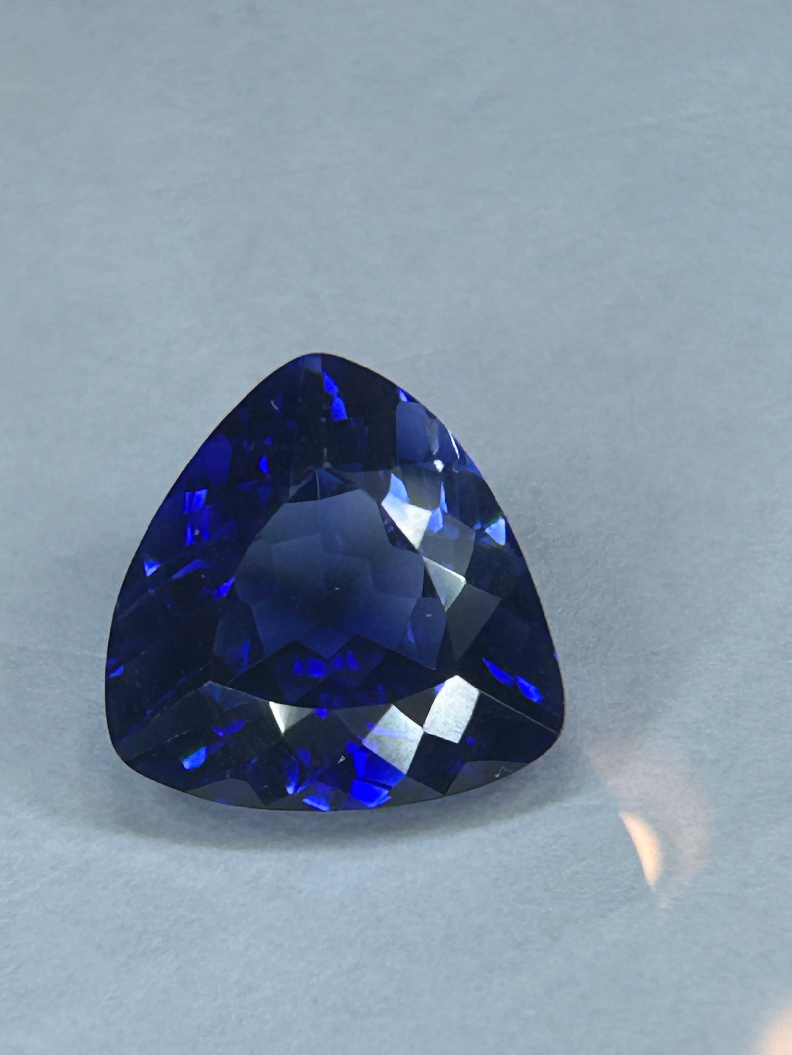 10.00 Carat -- Blue Sapphire --Trillion Cut --- Certified: a substantial and striking gemstone, typically featuring a triangular shape with faceted sides that maximize brilliance. At this size, these gems are often considered collector's items or investment p