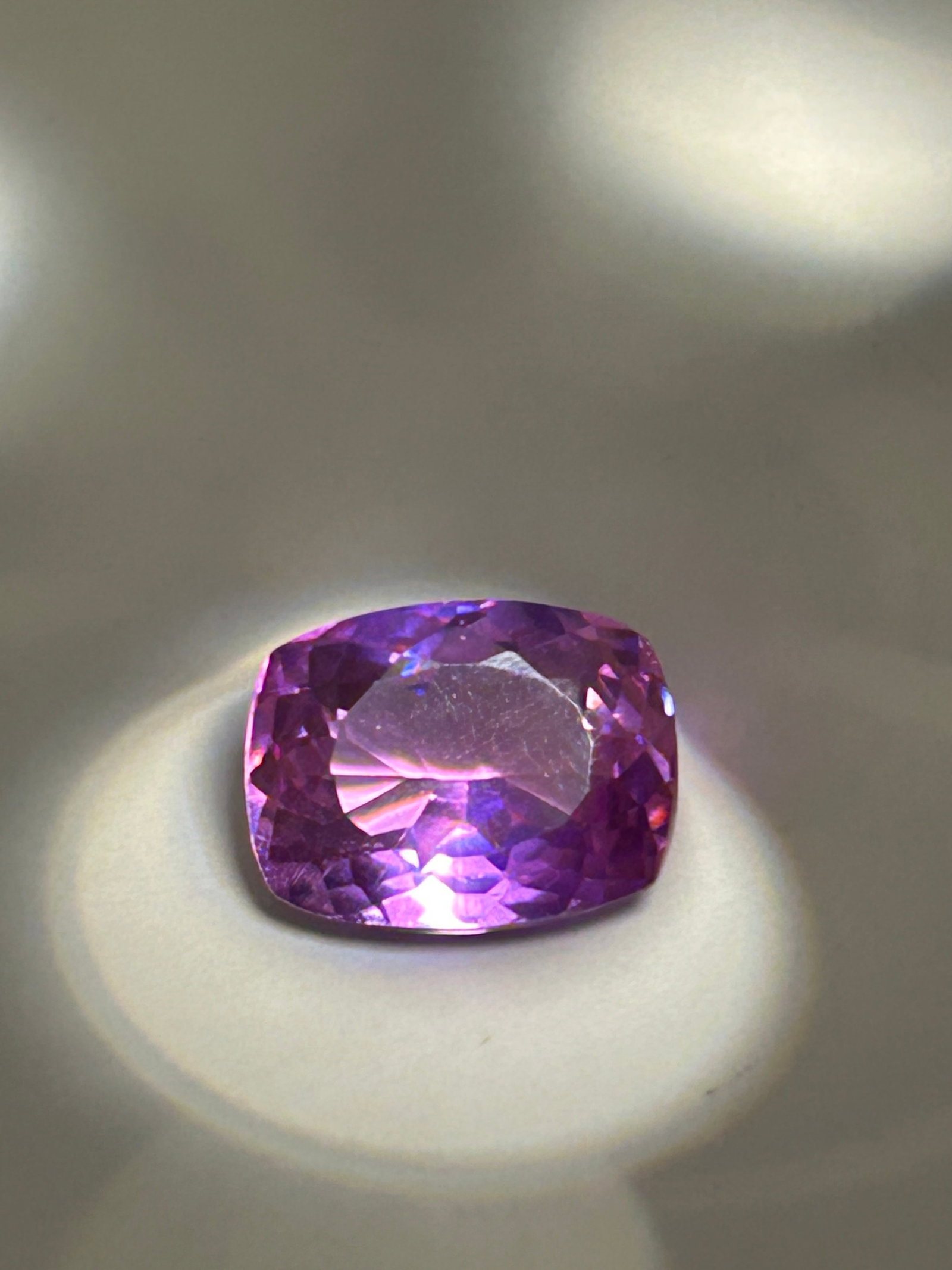 10,90 Carat --- Ceylon Raspberry Sapphire --- Cushion Cut --- EGL Certified: A vibrant gemstone. Known for an intense, juicy reddish-pink hue, it combines Sri Lankan pedigree with antique-inspired brilliance. Such a substantial gem typically serves as the majestic centerpiece 