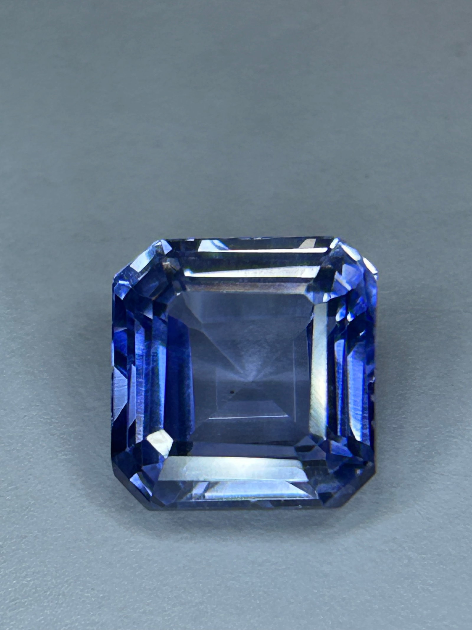 12.80 Carat --- Ceylon Blue Sapphire --- Asscher Cut --- EGL Certified: A stone of this size combines the highly sought-after, vibrant luster of Ceylon origin with the architectural, vintage elegance of the square, step-faceted Asscher cut.