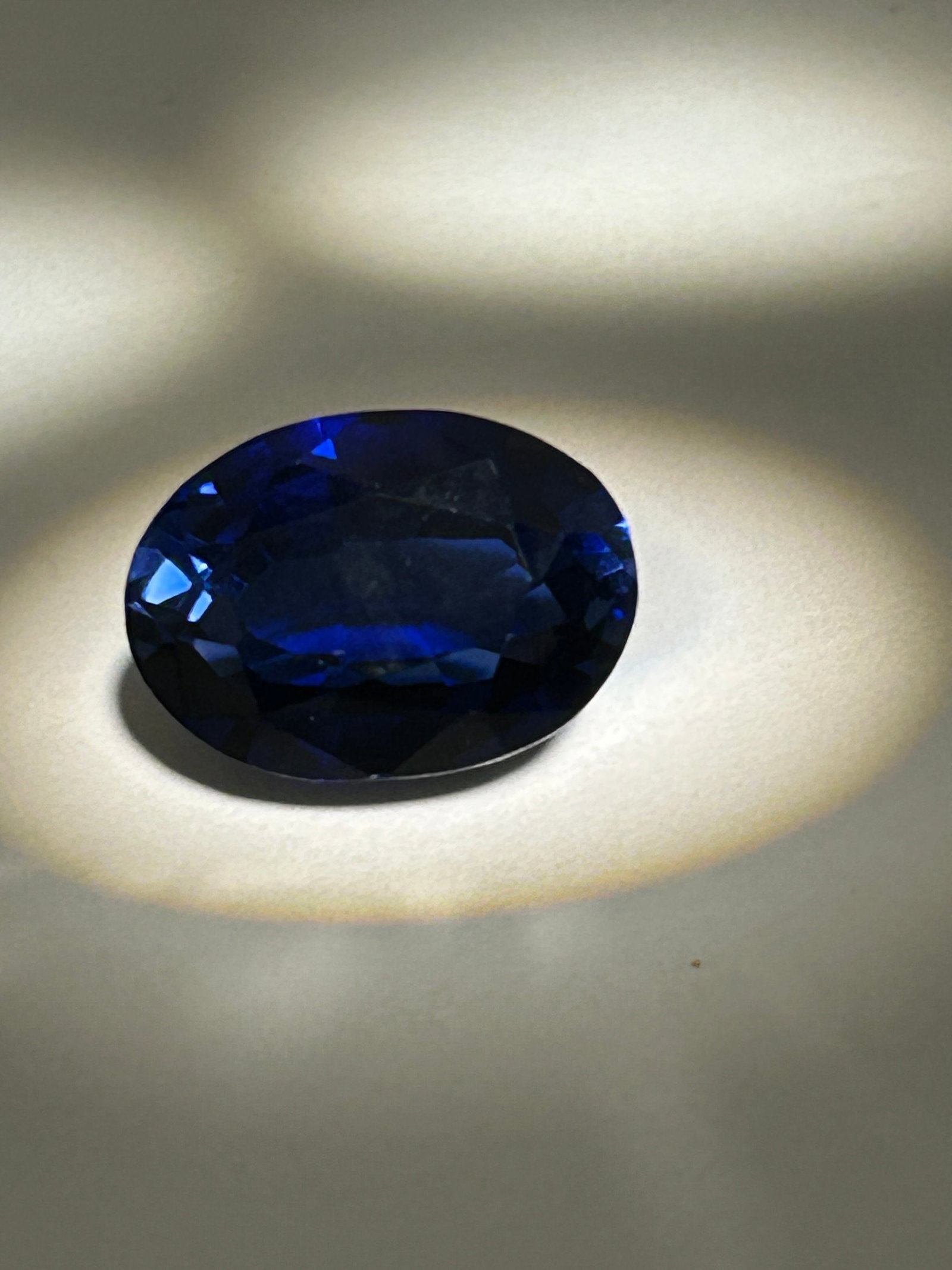 12.00 Carat --- Blue Sapphire--- Oval Cut --- GGI Certified: An exceptional and striking gemstone. Because 5-7+ carat high-quality sapphires are hard to source, a clean 12-carat stone demands a massive premium.