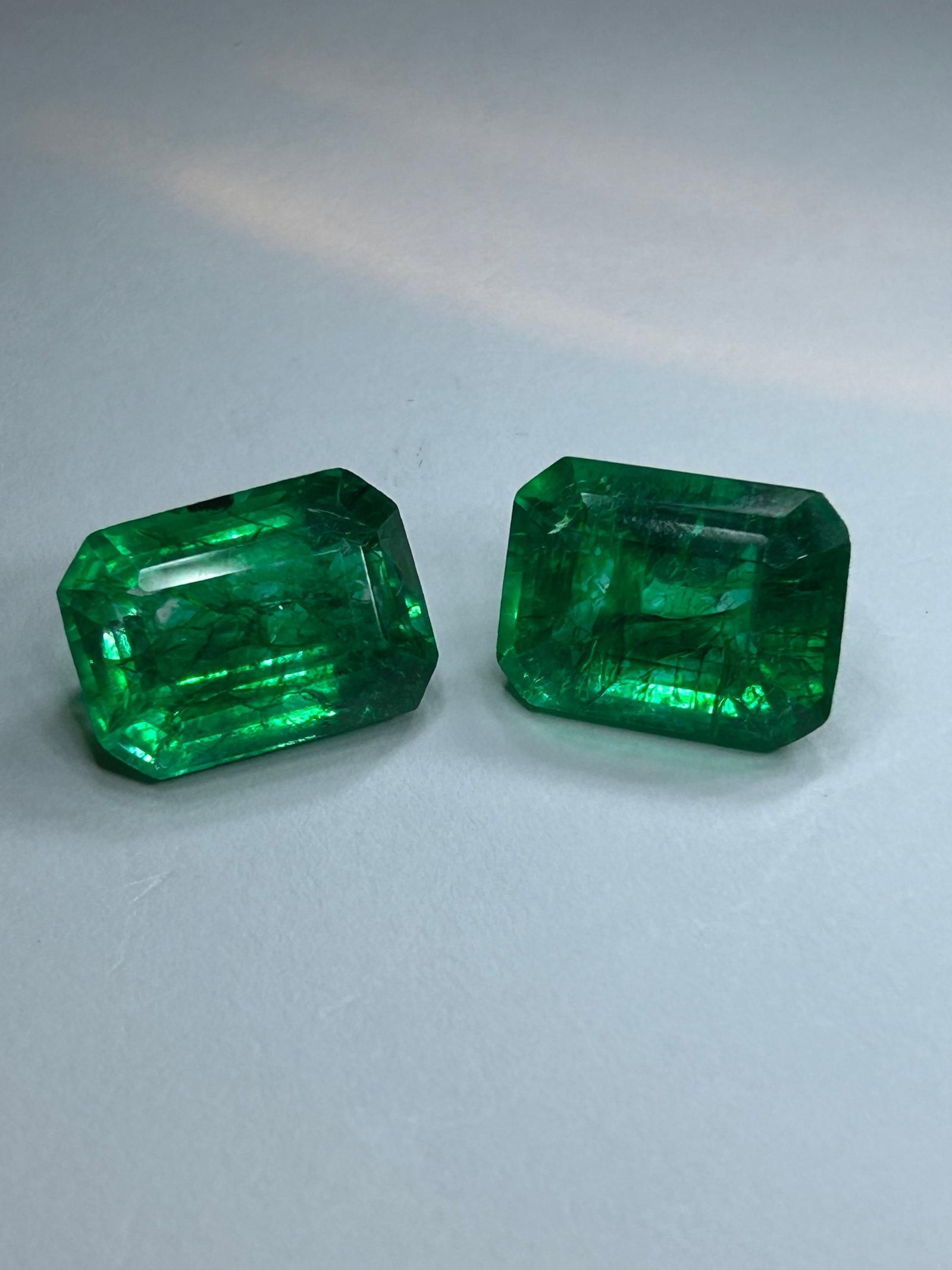 21.00 Carat tcw --- Colombian Green Emerald PAIR --- Step Emerald Cut --- EGL Certified: A matched pair of natural Colombian emeralds, classically cut and sized for impressive high-end fine jewelry like statement earrings or a centerpiece ring. Colombian emeralds are globally prized for t