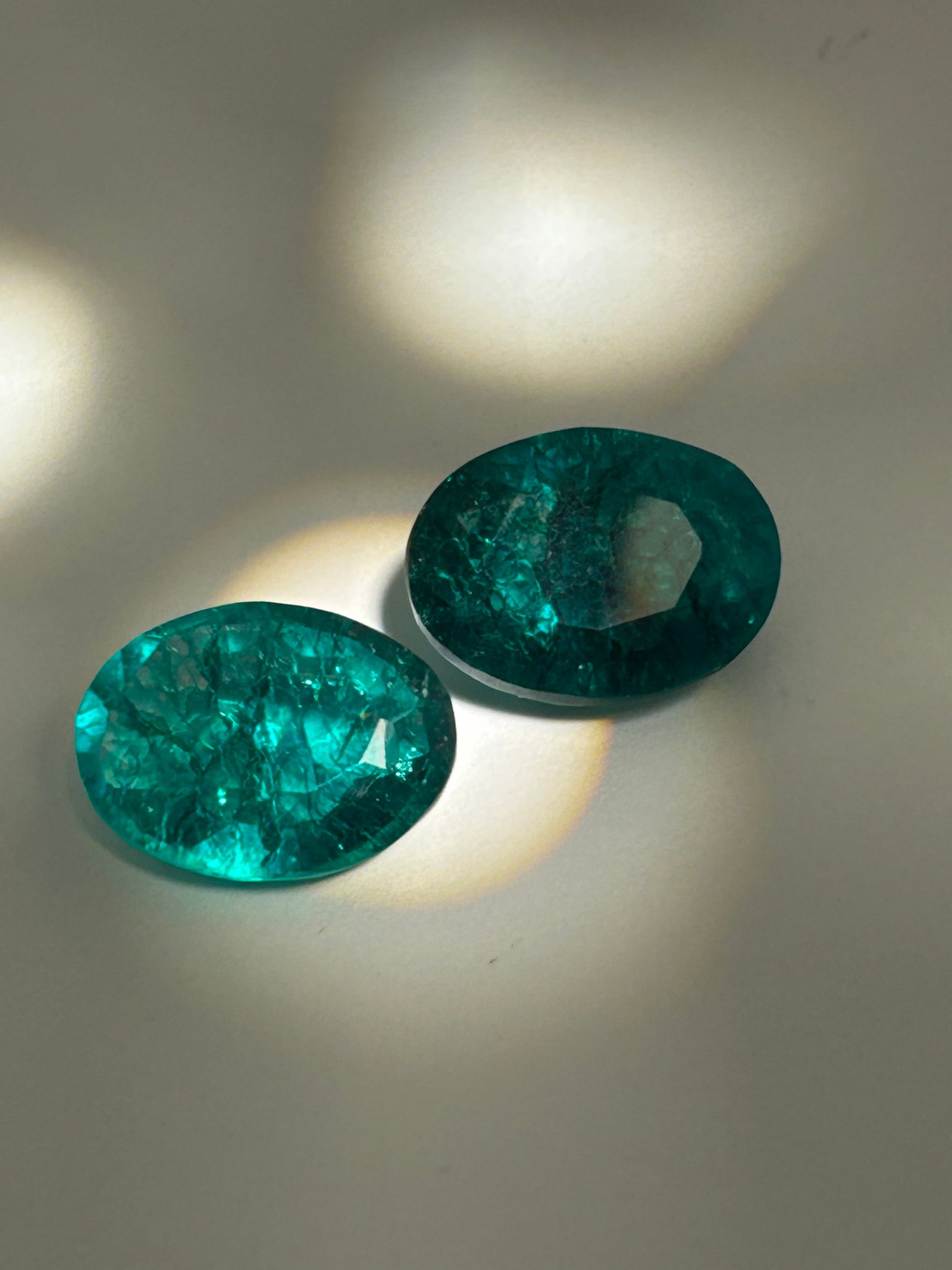 20.00 Carat tcw --- Colombian Green Emerald PAIR --- Oval Cut --- EGL Certified: A remarkable and luxurious set of gemstones, typically reserved for high-end, bespoke jewelry like statement earrings or a multi-stone necklace. Colombian emeralds are universally prized for their exc
