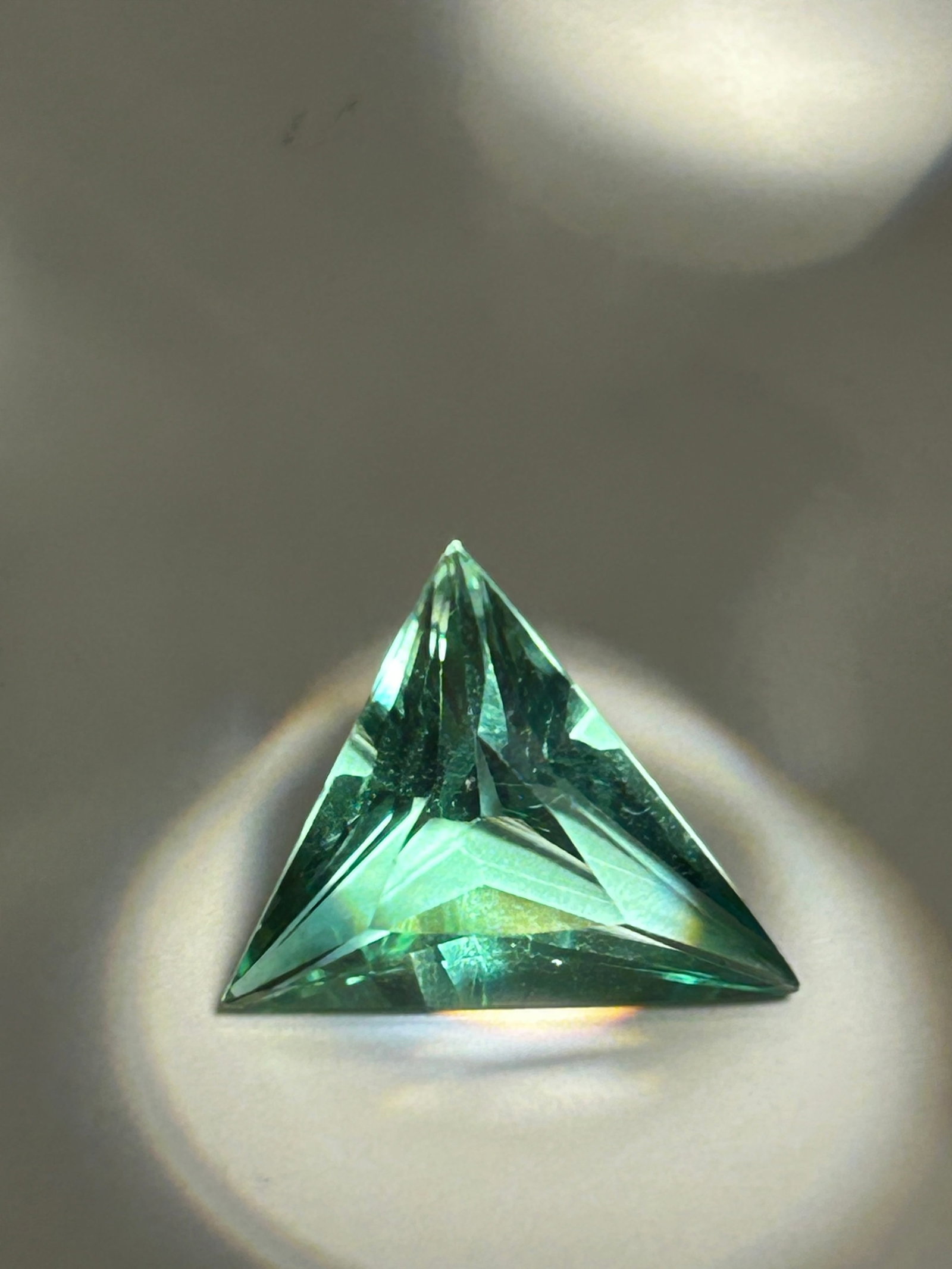 8.5 Carat --- Green Sapphire --- Trillion Cut --- EGL Certified: An unconventional gemstone. With its eye-catching triangular shape and rich, earthy tones, this magnificent gem is ideal for a striking custom centerpiece in fine jewelry.