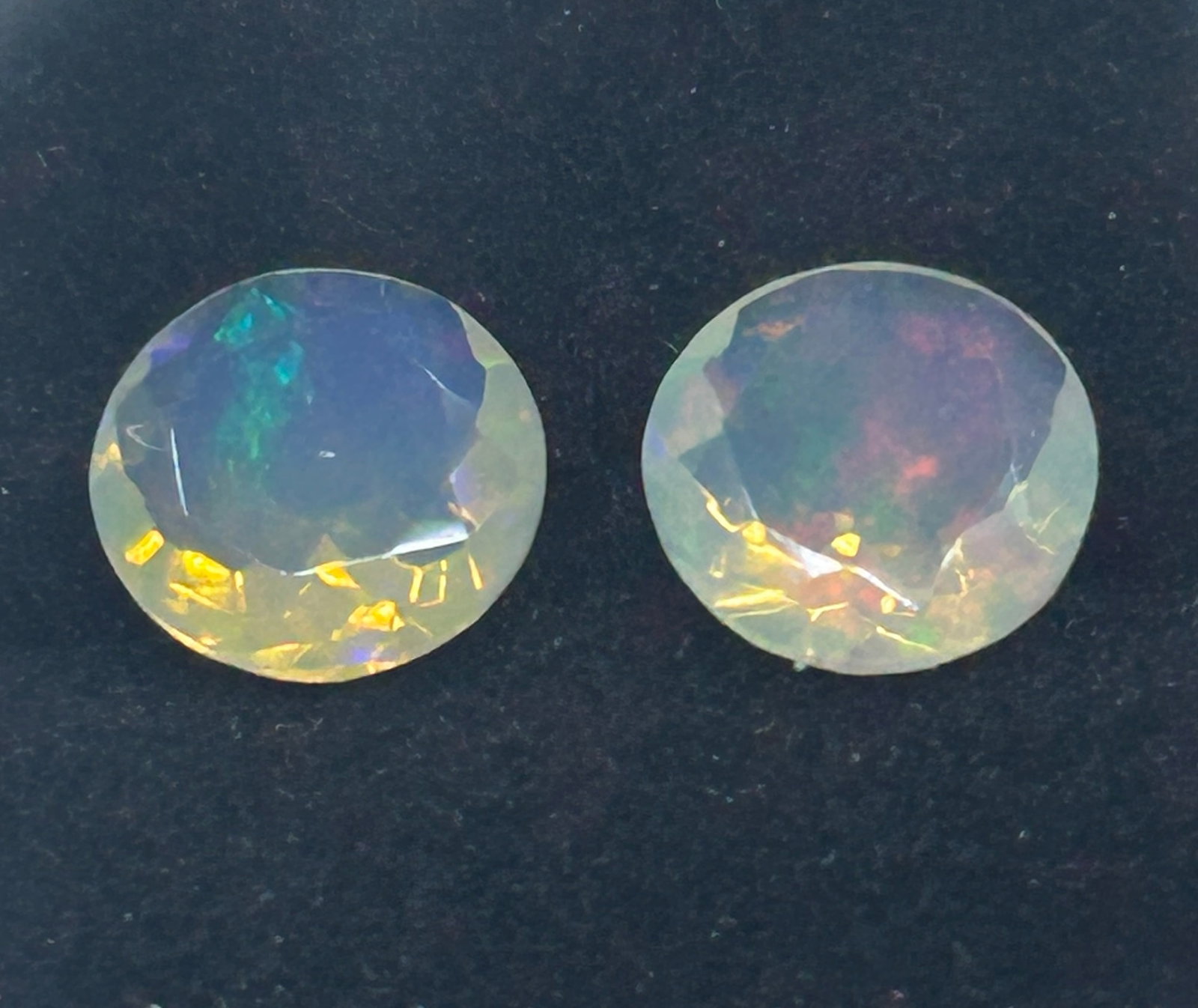 1.86 Carat --- Natural Welo Opal --- Round Cut----Pair: Two perfectly matched, loose natural opals from the Welo region of Ethiopia. Round-cut opals are highly prized for showcasing vibrant "play-of-color" (flashy, multi-color fire). Because natural gems a