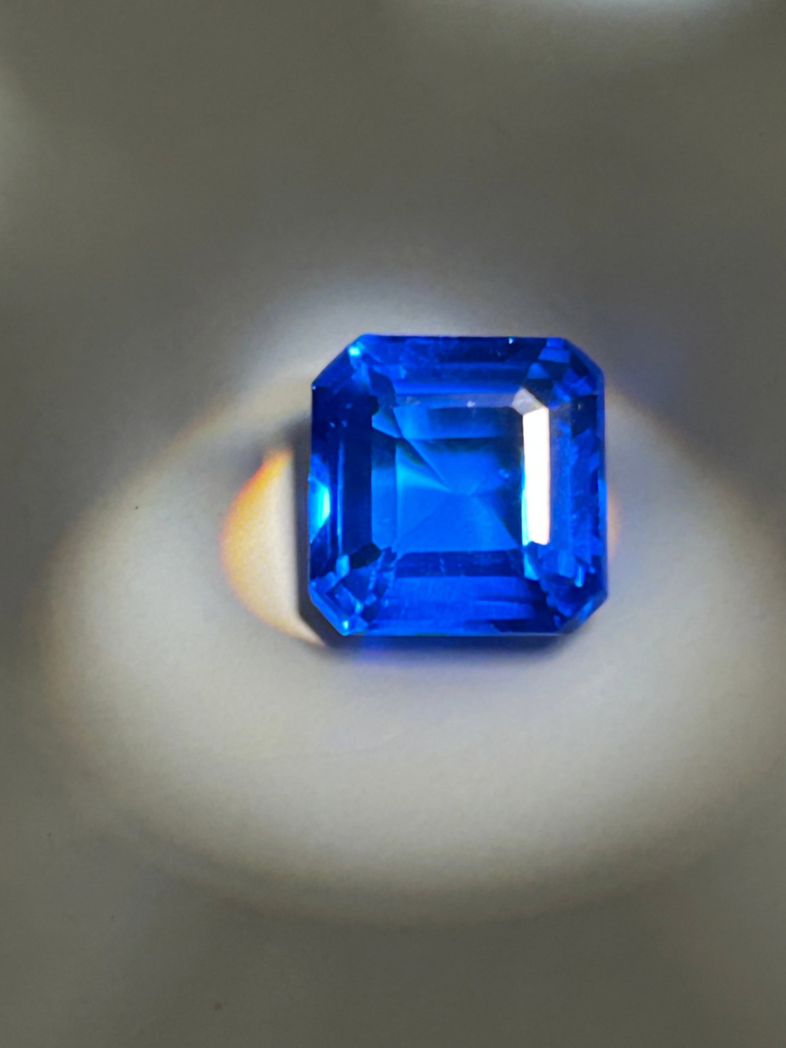 9.25 Carat --- Royal Blue Sapphire--- Radiant Cut --- GGI Certified: This stone demands attention, boasting deep, velvety saturation and a brilliant, multifaceted cut that maximizes sparkle and masks internal inclusions