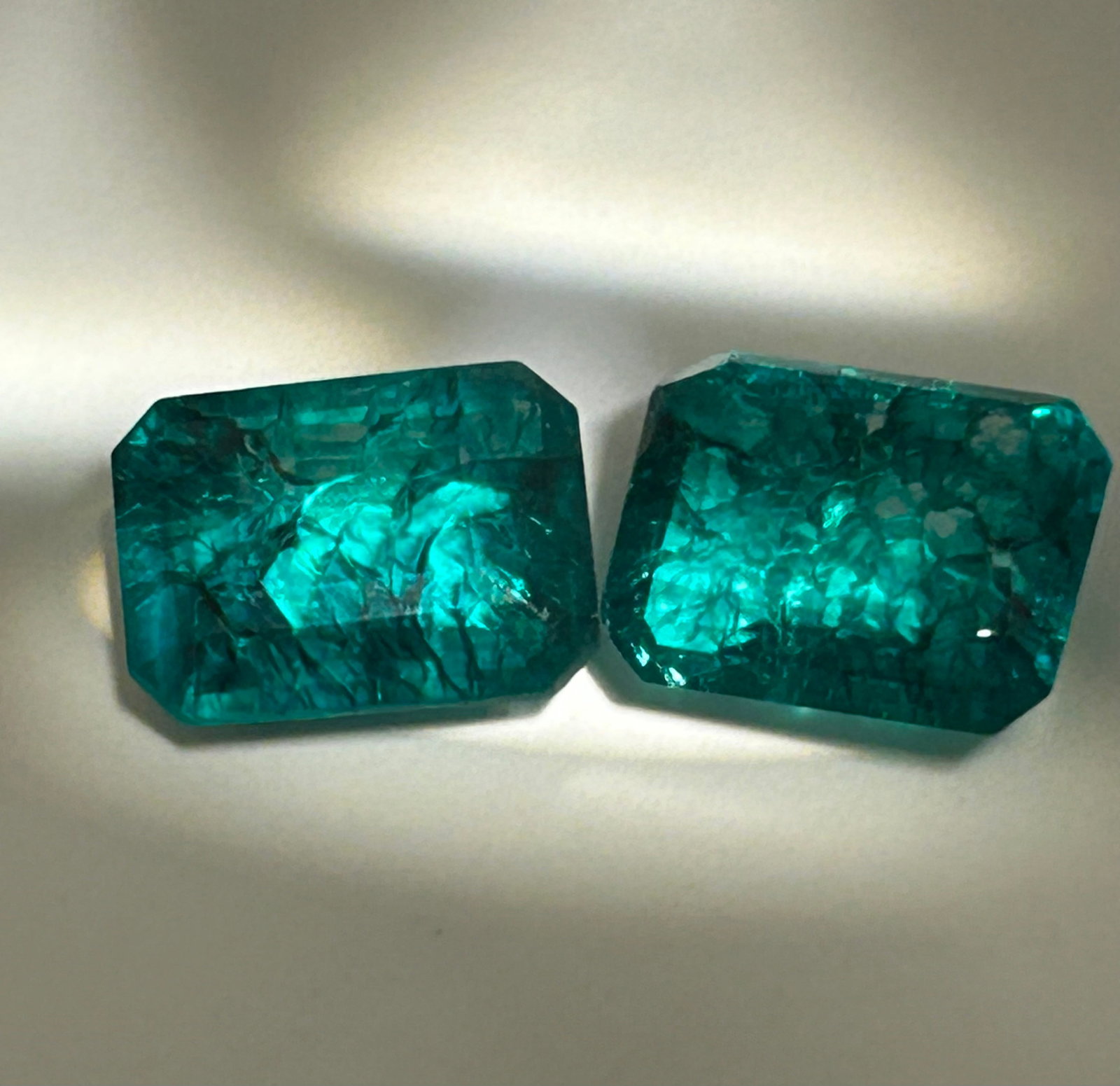 11.00 Carat --- Colombian Green Emerald--- Emerald Step Cut-PAIR --EGL Certified: Featuring an emerald step cut, they display a vivid green hue, a geometric step-like faceting pattern, and exceptional brilliance. They are highly prized for creating luxury fine jewelry.