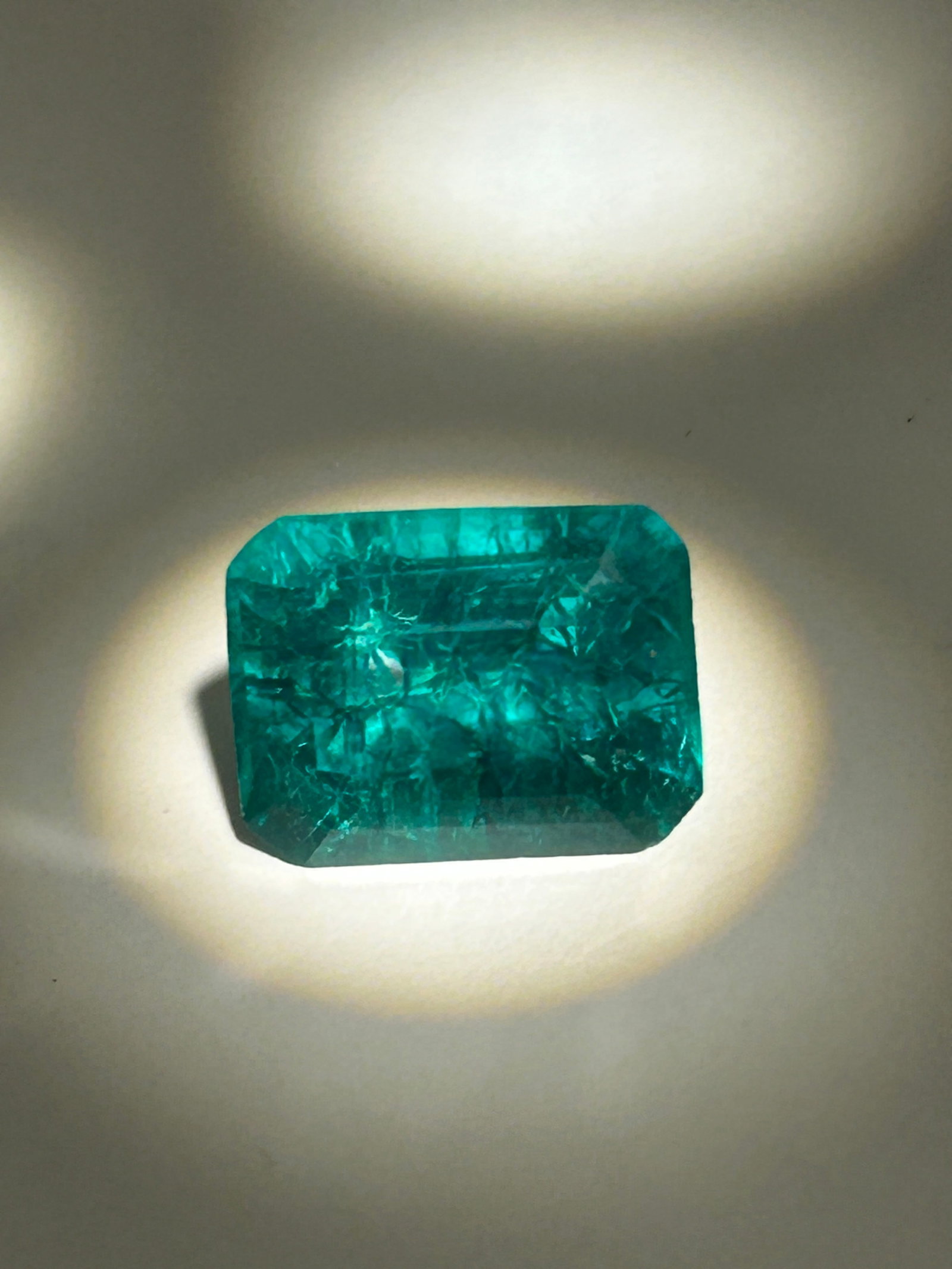 8.10 Carat ---- Colombian Green Emerald ---- Emerald Step Cut ---- EGL Certified: This combination highlights a deeply saturated, pure green color paired with a tailored, geometric faceting style that maximizes the stone's inner brilliance and crystalline clarity.