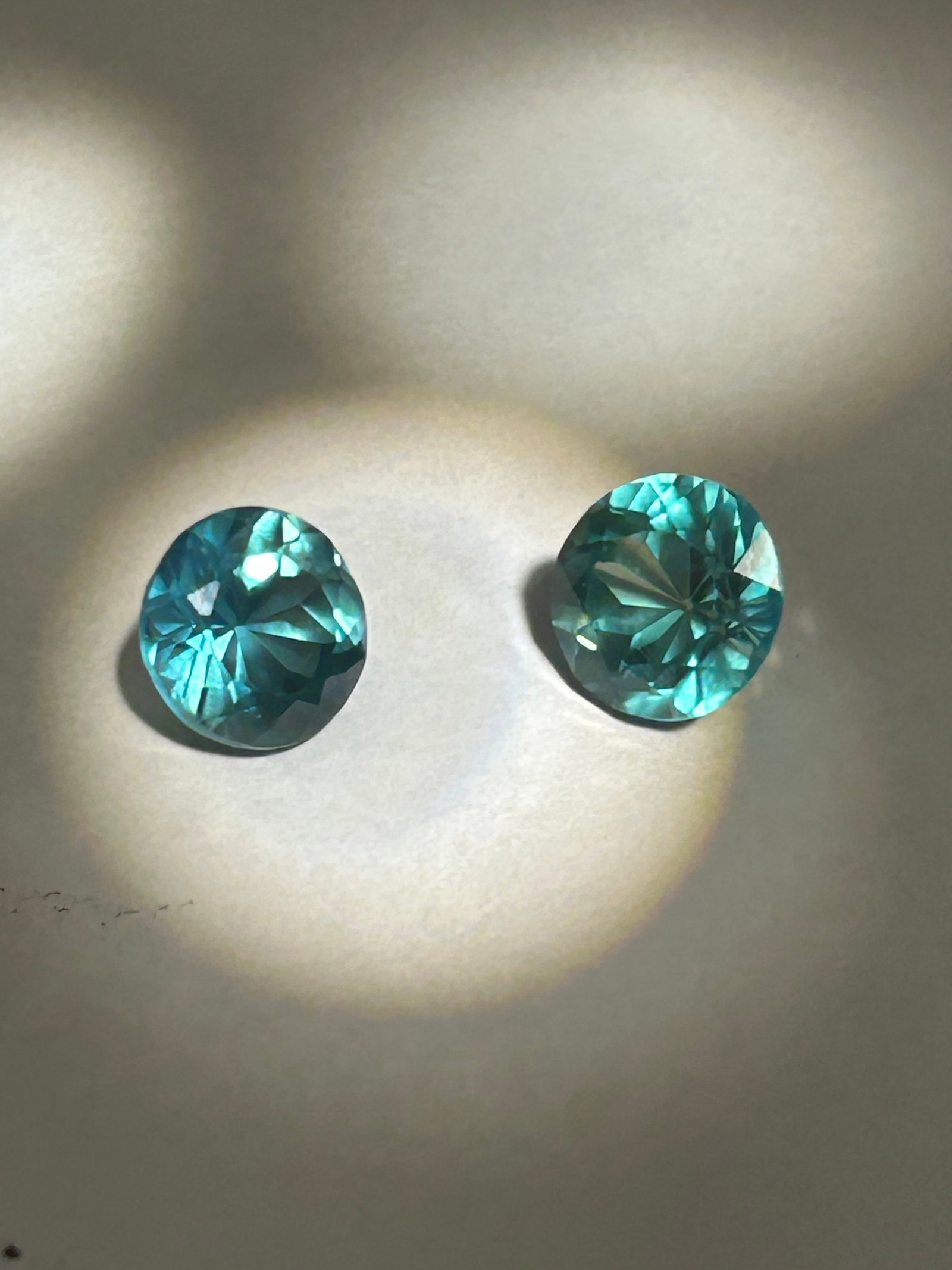 6.59 Carat ----Green Sapphire Pair----Round Cut: Two perfectly matched, round-cut green sapphires. Cut to brilliant standards, this rare set is ideal for fine jewelry.
