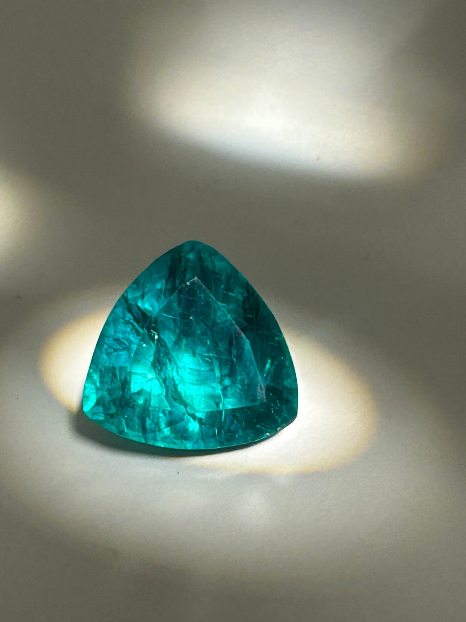7.5 Carat ----Colombian Green Emerald ----Trillion Cut: An eye-catching gemstone. Colombian emeralds are globally prized for their highly saturated, pure green hue with fewer dark or bluish overtones. Combined with a triangular trillion cut, this gem maxim