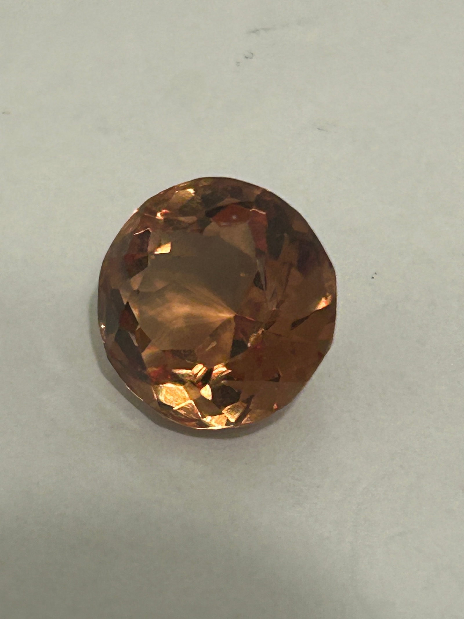 11.55 Carat ---- Natural Alexandrite Brown to Yellow ----- Round Cut: Characterized by a color change from brown to yellow. It is a large, color-changing gemstone, used in custom jewelry due to its substantial size and striking, unusual color shift. Alexandrites are cat
