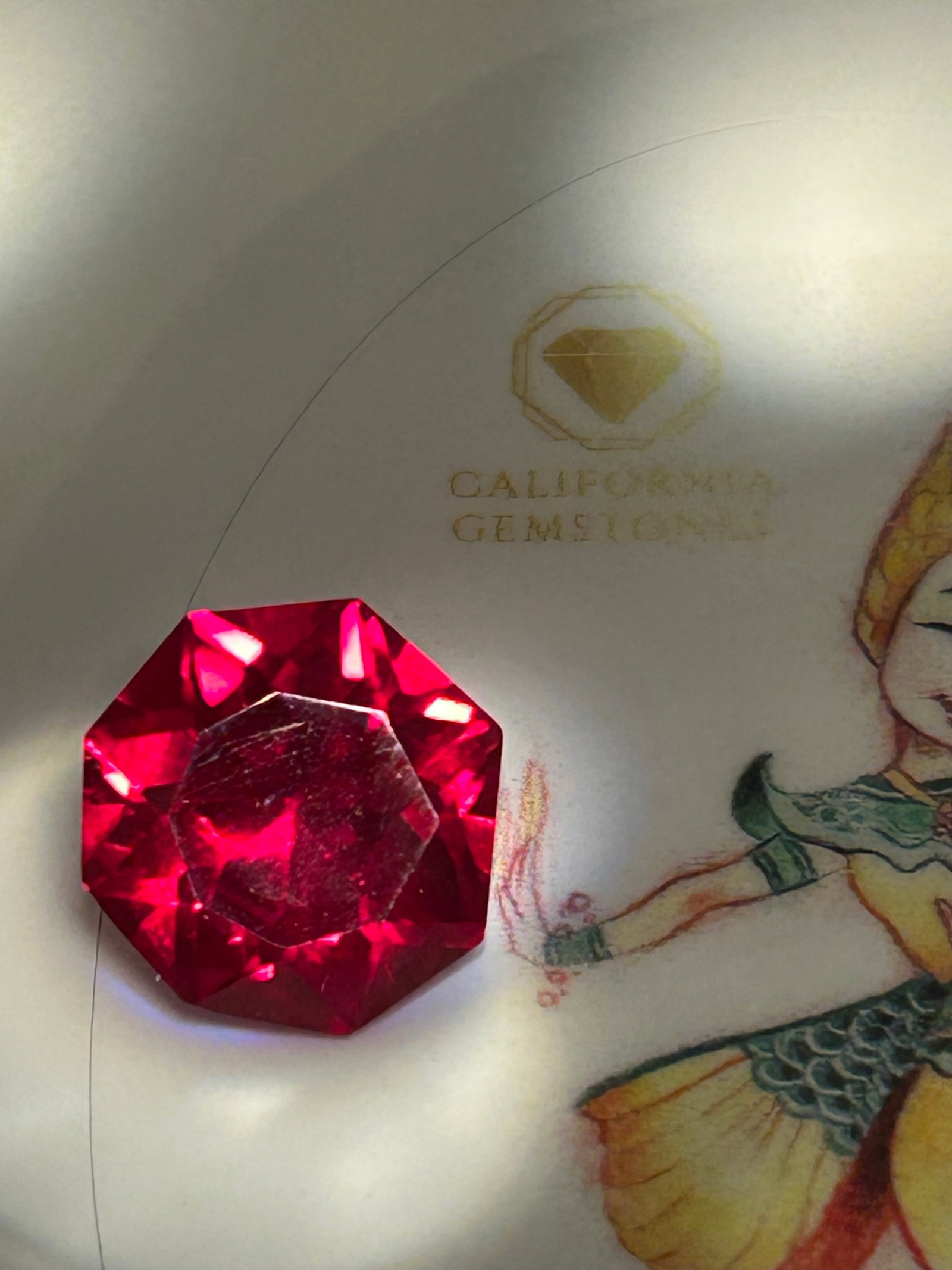 9 Carat --- Myanmar Red Ruby ---- Radiant Nova Cut: A brilliant gemstone. It features a deeply saturated, vivid red "pigeon's blood" hue paired with a precision-faceted modified brilliant pattern.
