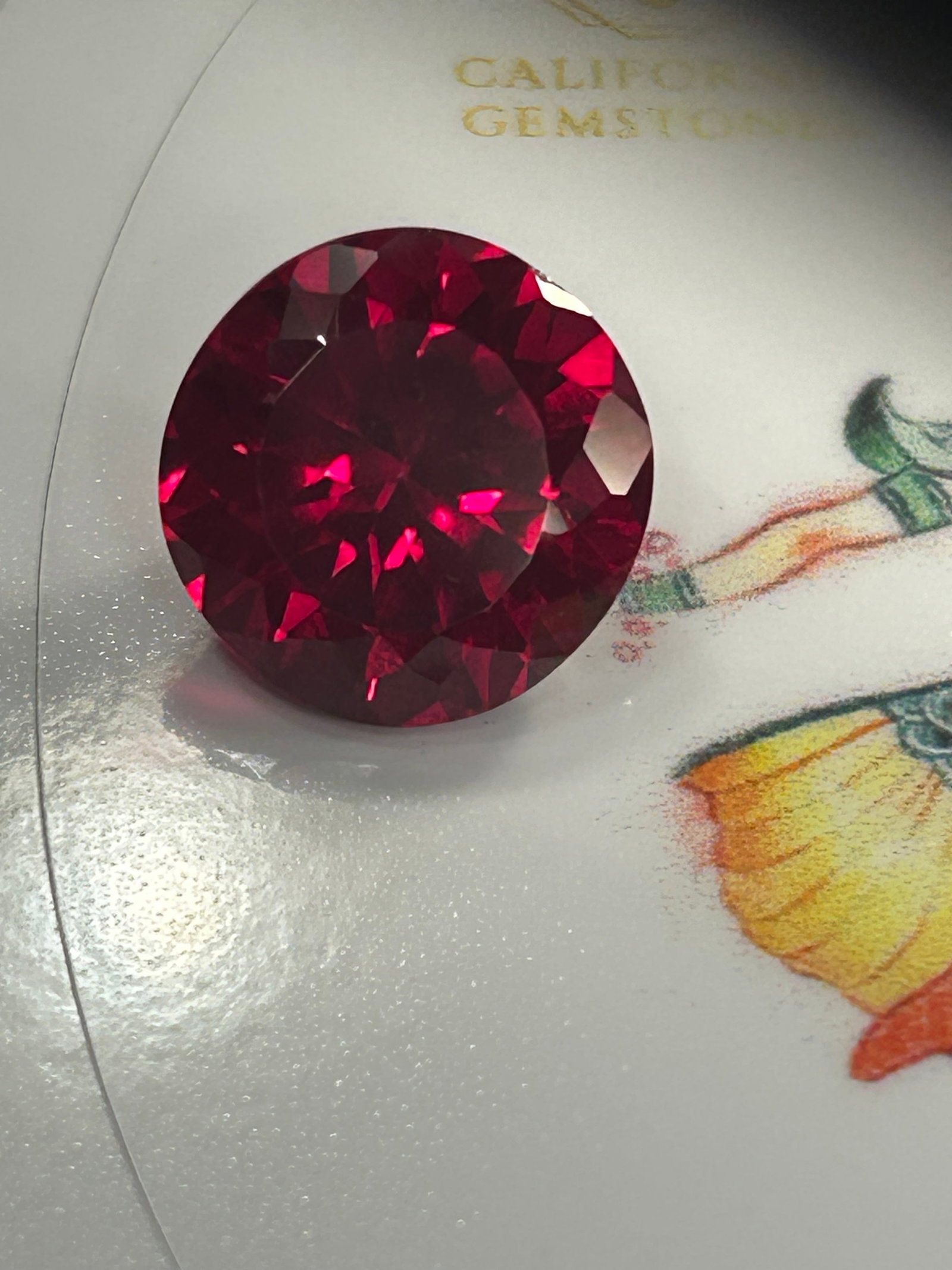 9 Carat ---- Myanmar Deep Red Ruby ---- Brilliant Round Cut: Myanmar produces some of the most coveted, highly valued rubies in the world, renowned for their vivid "pigeon's blood" red hue and intense natural fluorescence. Historically sourced from the Mogok Va