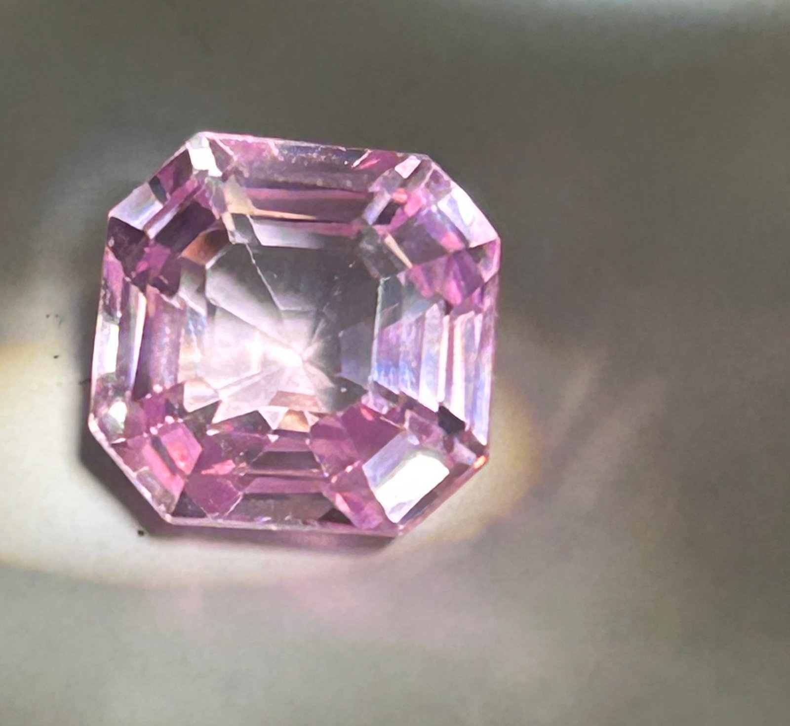 11.9 Carat ---- Pink Morganite ----Asscher Cut: High-clarity gemstone characterized by a soft, romantic, peachy-pink hue and a "step-cut" facet pattern that highlights internal purity. Given the weight, such a stone is generally intended for a stat