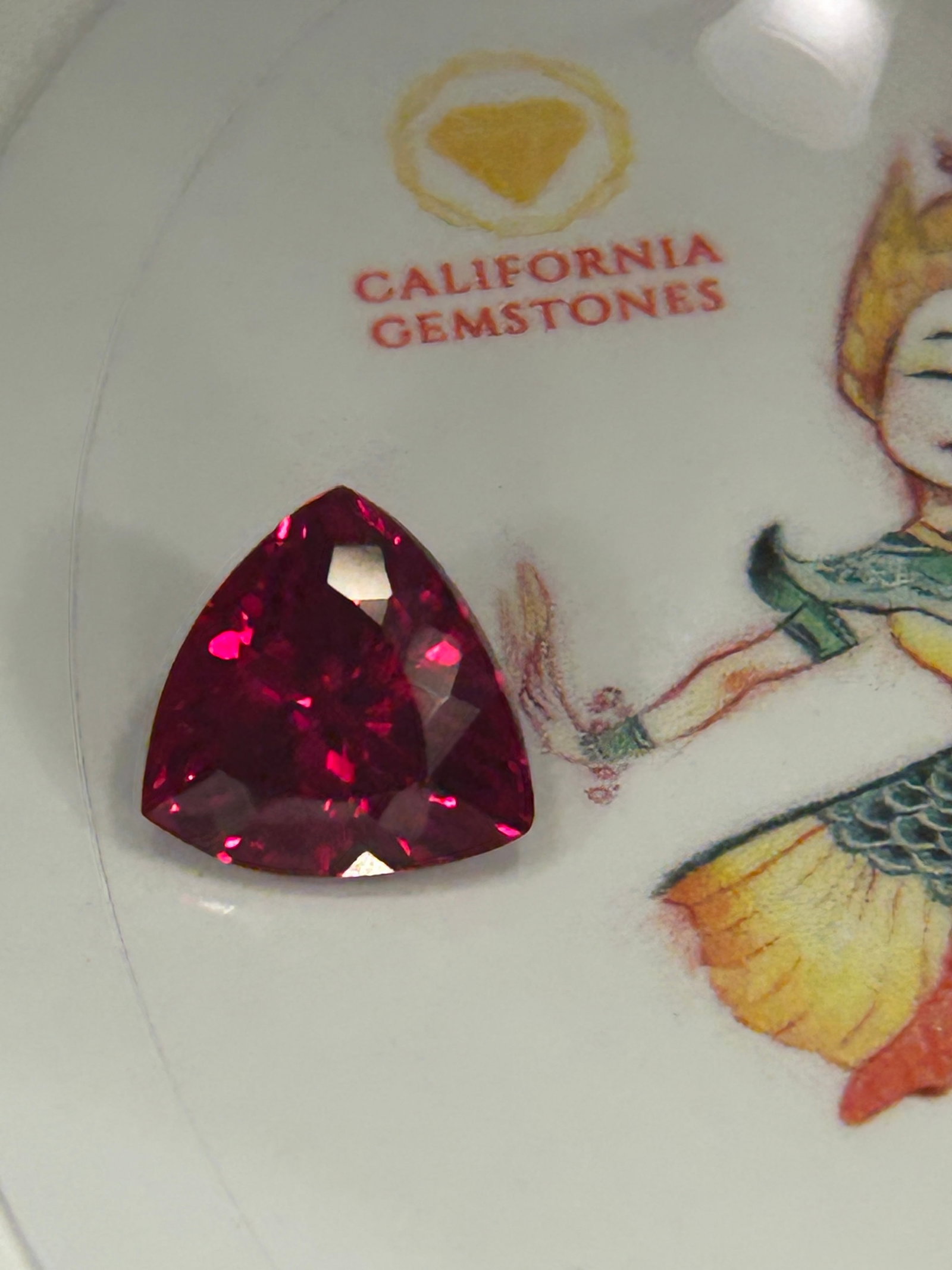 9.00 Carat ---- Myanmar Red Ruby --- Brilliant Trillion Cut: This 9.00-carat Burmese red ruby is a museum-quality, ultra-rare gemstone. It features the iconic, vivid "pigeon's blood" crimson hue and a brilliant trillion cut, which maximizes optical sparkle and 