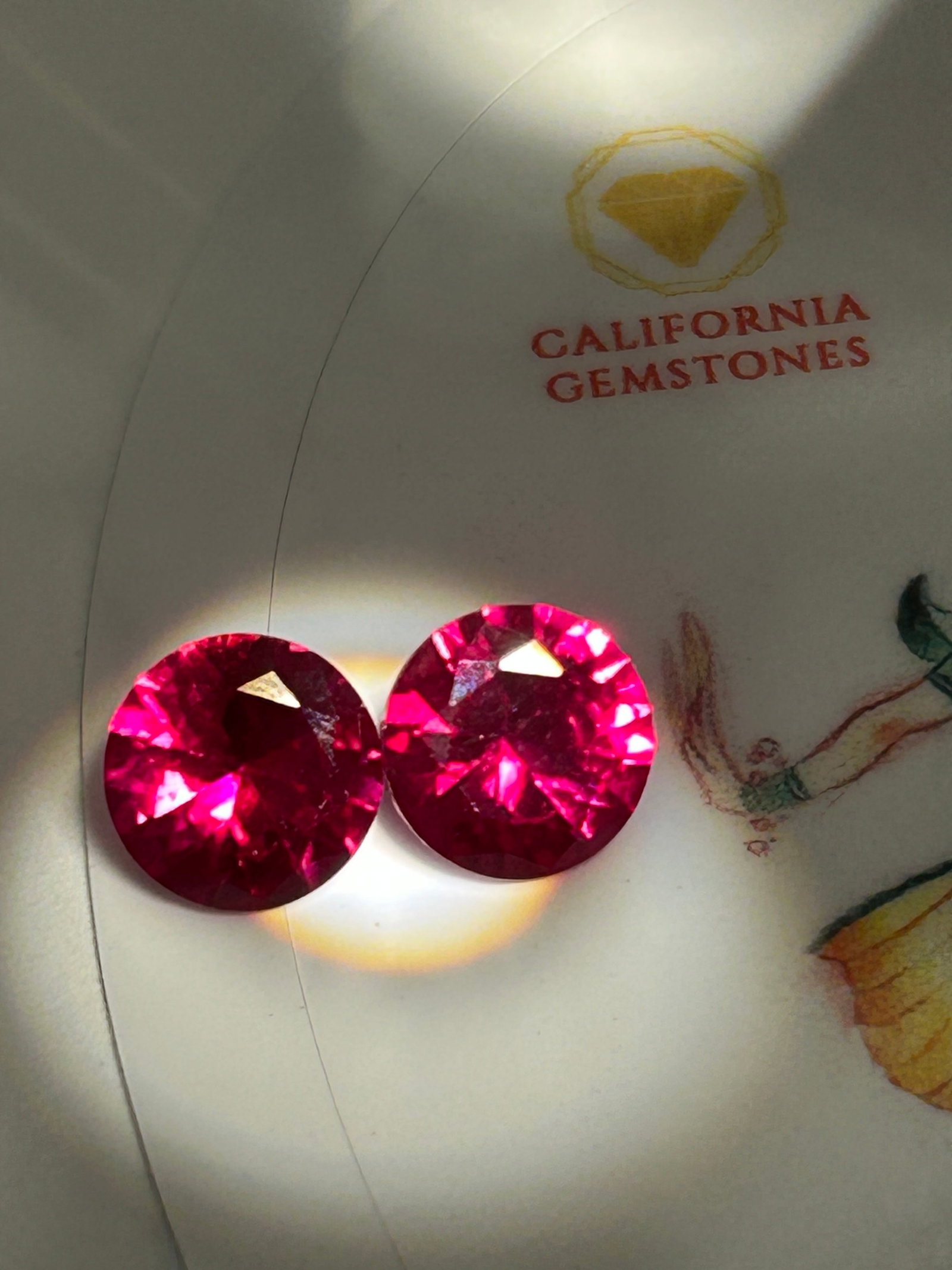 5.0 Carat ---- Mozambique Blood Ruby --- Round Cut PAIR: Matched, natural Mozambique gemstones displaying a highly sought-after vibrant, vivid red saturation. Known for their excellent transparency and fiery brilliance.