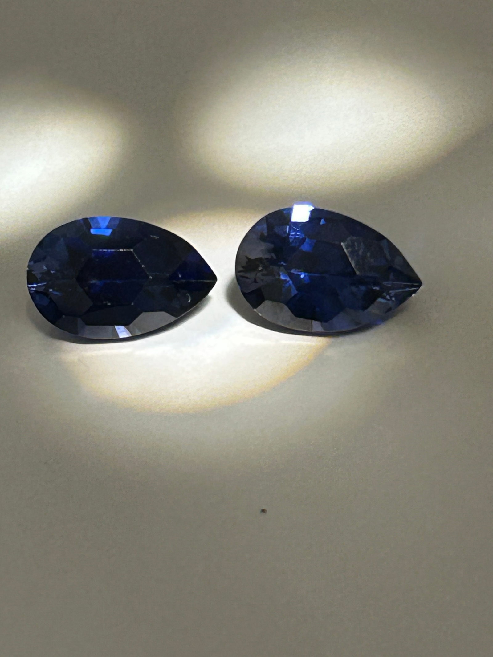 20 Carat ---- Pair Brazilian Almost Purple Sapphire ----- Pear Cut: Characterized by a deep, rich hue with notable clarity and a durable Mohs hardness of 9. Near identical pear cuts, feature strong, vibrant, deep plum color.