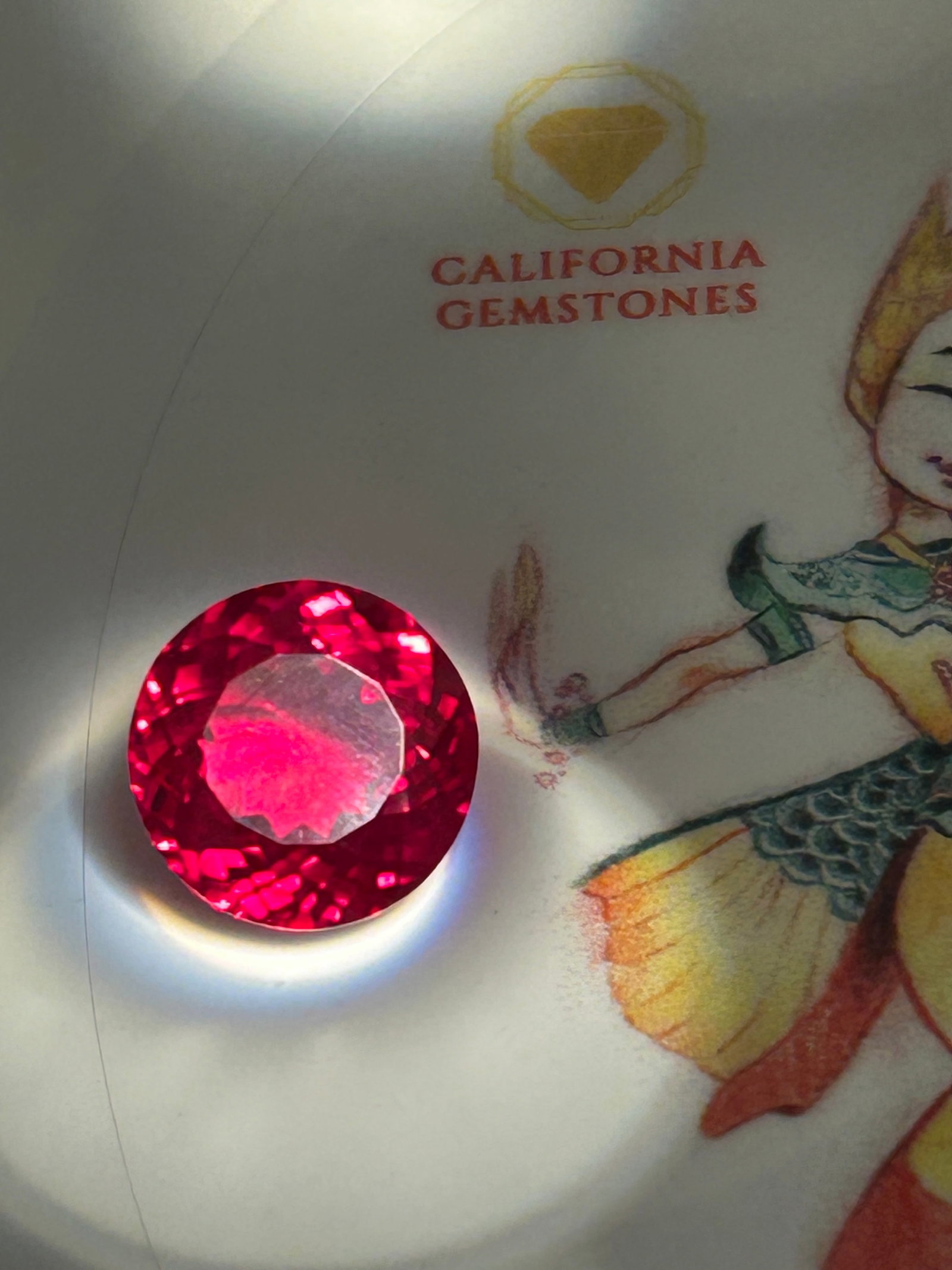 6 Carat ---- Red Spinel ----- Round Brilliant Cut: It boasts a fiery, glowing crimson hue and exceptional light performance. Often prized as an exquisite ruby alternative, high-quality spinels are valued for their durability and lack of treatment.