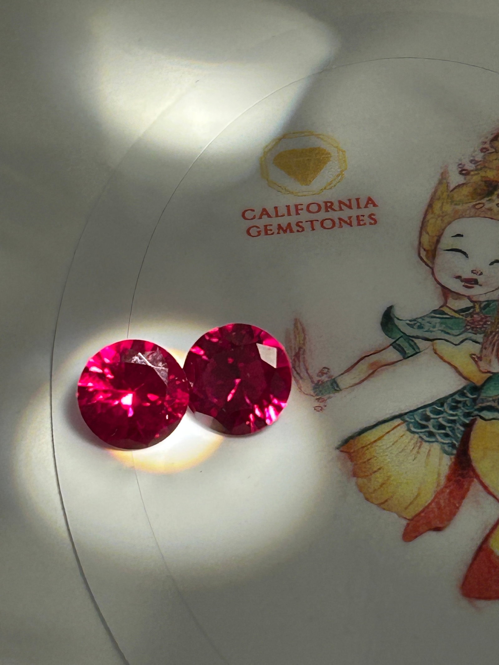 5 Carat ---- Mogok Red Ruby Pair ----- Round Brilliant Cut: A pair of prestigious gemstones, with "Pigeon Blood" representing the most coveted, vivid, and saturated red color found in rubies. Originating from the Mogok region in Burma, these rubies are valued 