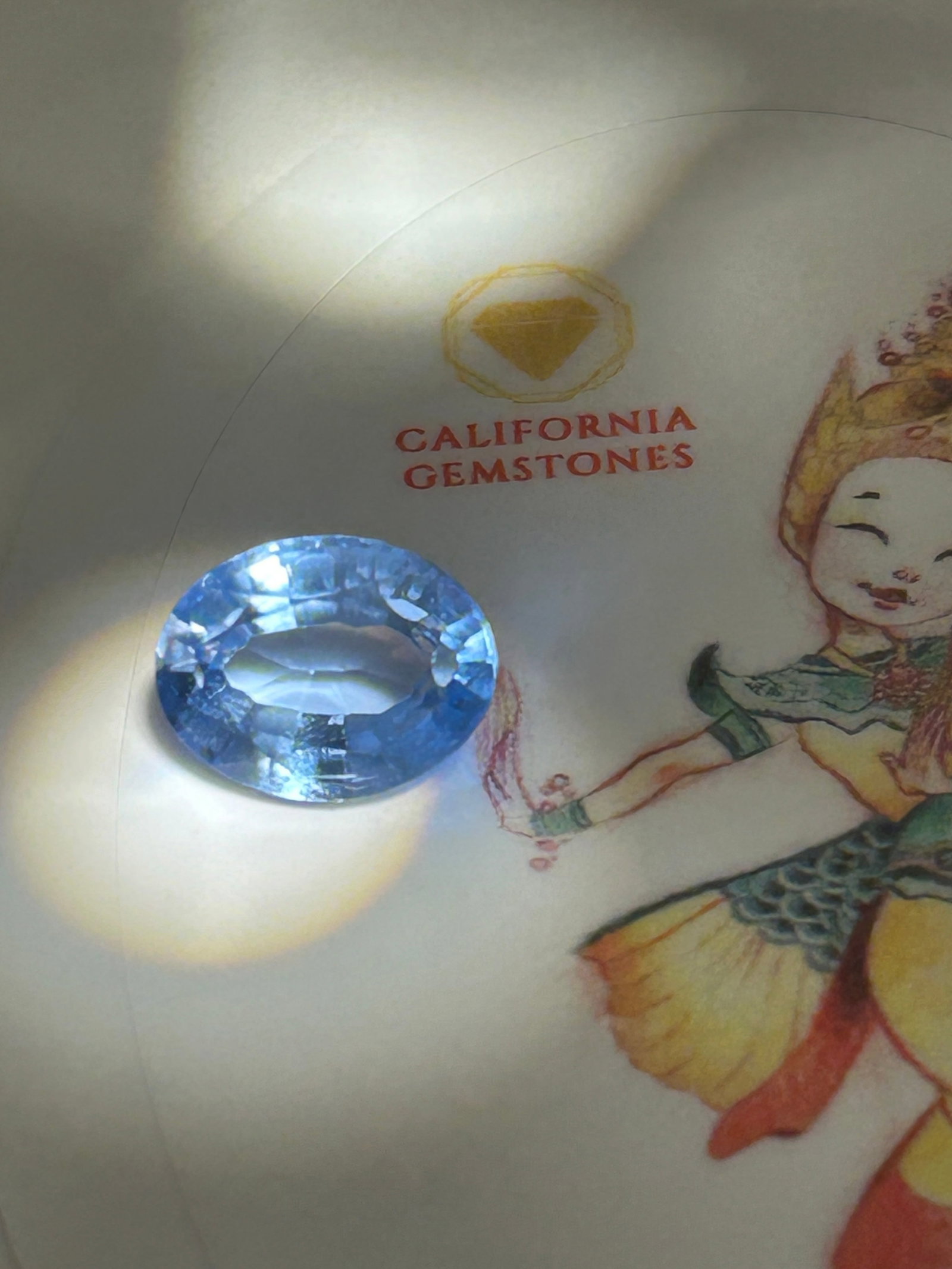 10 Carat ---- Brazilian Blue Tourmaline ---- Oval Cut---- GGI Certified: Investment-grade gemstone. It is famous for its subtle blue hues and brilliant internal glow, making it highly prized for high-end custom jewelry.