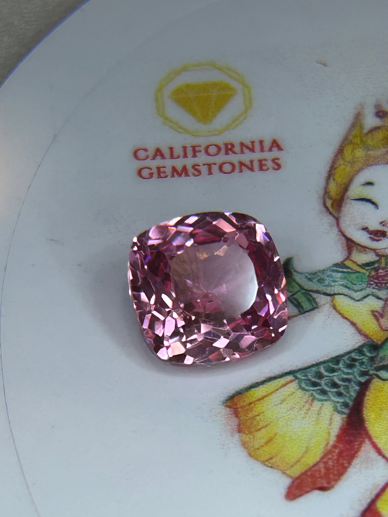 9.90 Carat ---- Padparadscha Sapphire ---- Cushion Cut---- EGL Certified: An extraordinary gemstone, highly prized by collectors and jewelry connoisseurs. It is defined by a delicate, harmonious blend of pink and orange hues, reminiscent of a tropical sunset or a lotus blos