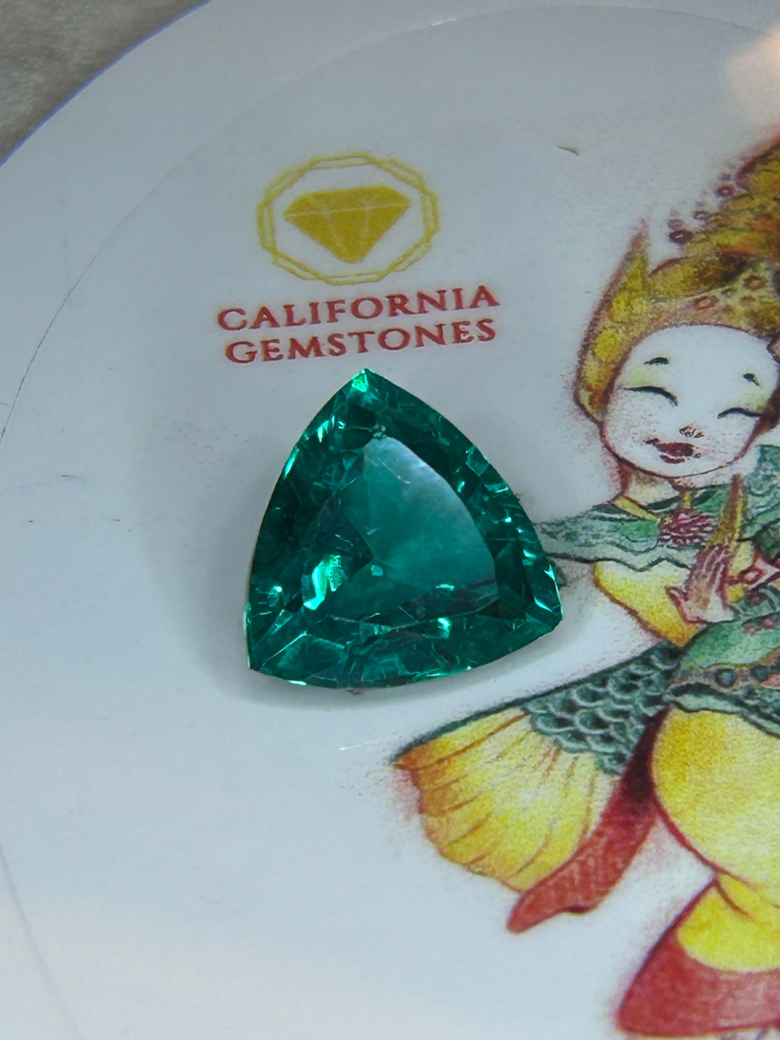 10.50 Carat ---- Natural Teal Tourmaline ---- Trillion Cut----GGL Certified: A striking gemstone. The trillion cut maximizes both fire and brilliance, displaying a captivating ocean-blue and green color. It is a highly coveted stone for custom statement jewelry, such as rings 
