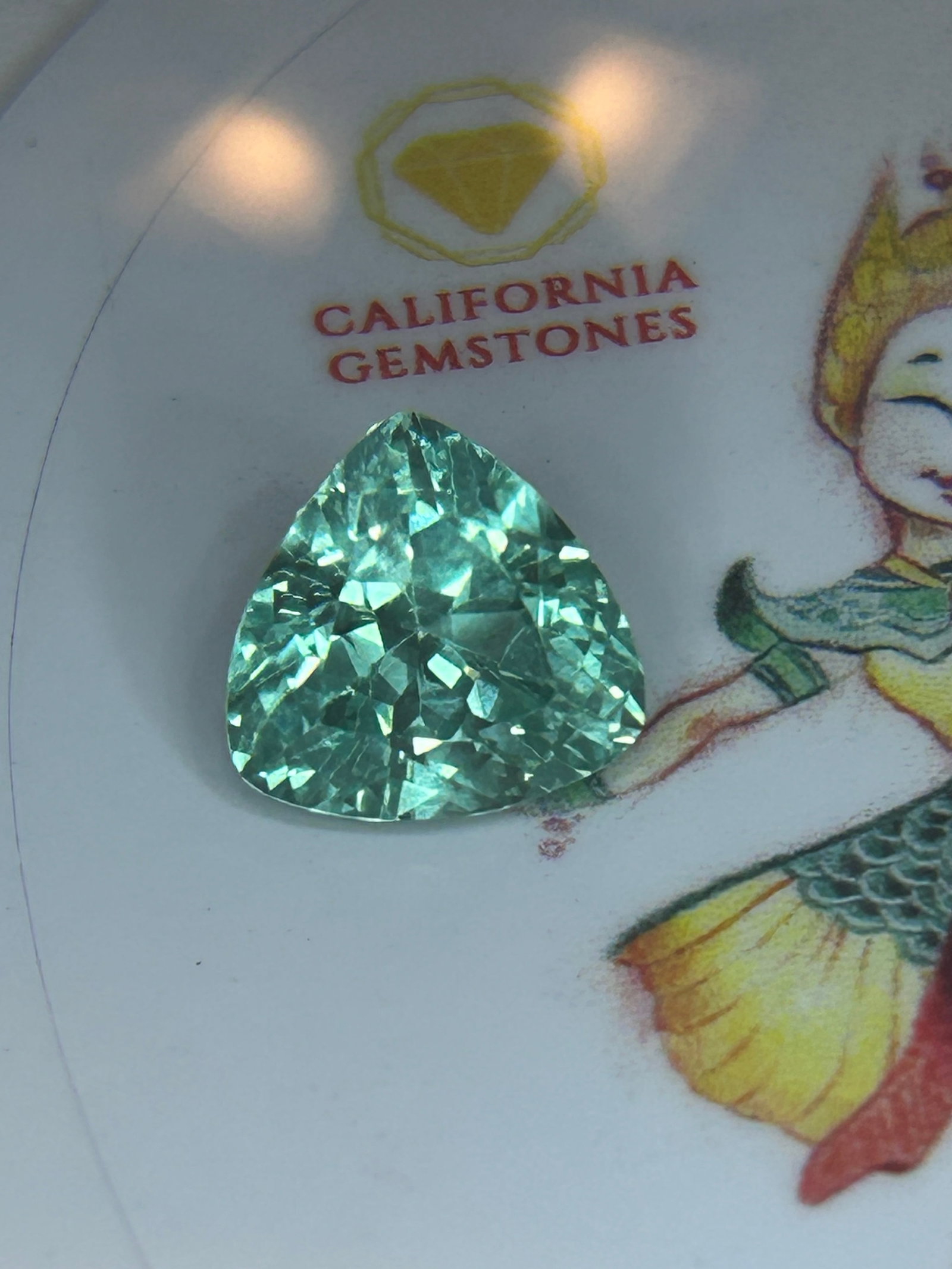 7.50 Carat ---- Natural Indian Green Sapphire ---- Trillion Cut ----- European Gem Lab Certified: Highly coveted for its aquatic tones, this exact size, color profile, and versatile oval cut make it a prime candidate for a breathtaking centerpiece