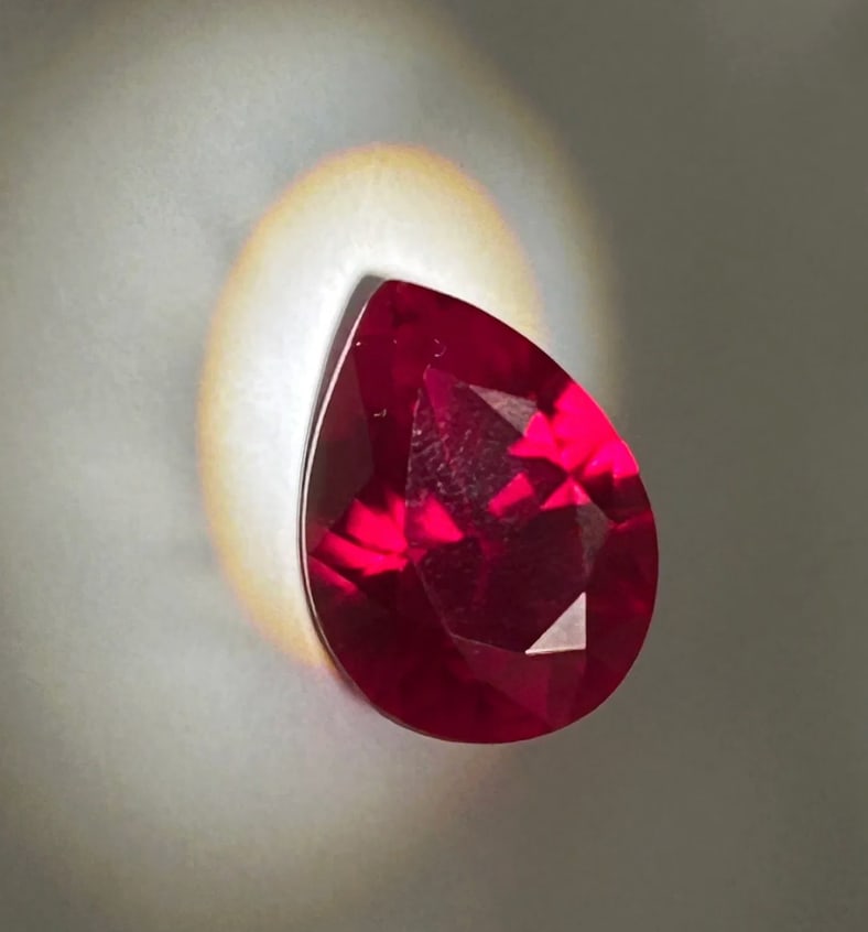 7.9 Carat ---- Mozambique Blood Ruby ---- Pear Cut ---- GIR Certified: An exceptional gemstone characterized by a vibrant, "pigeon blood" red hue, high saturation, and intense brilliance. This stones feature mixed brilliant cutting to optimize light return, highlighting 
