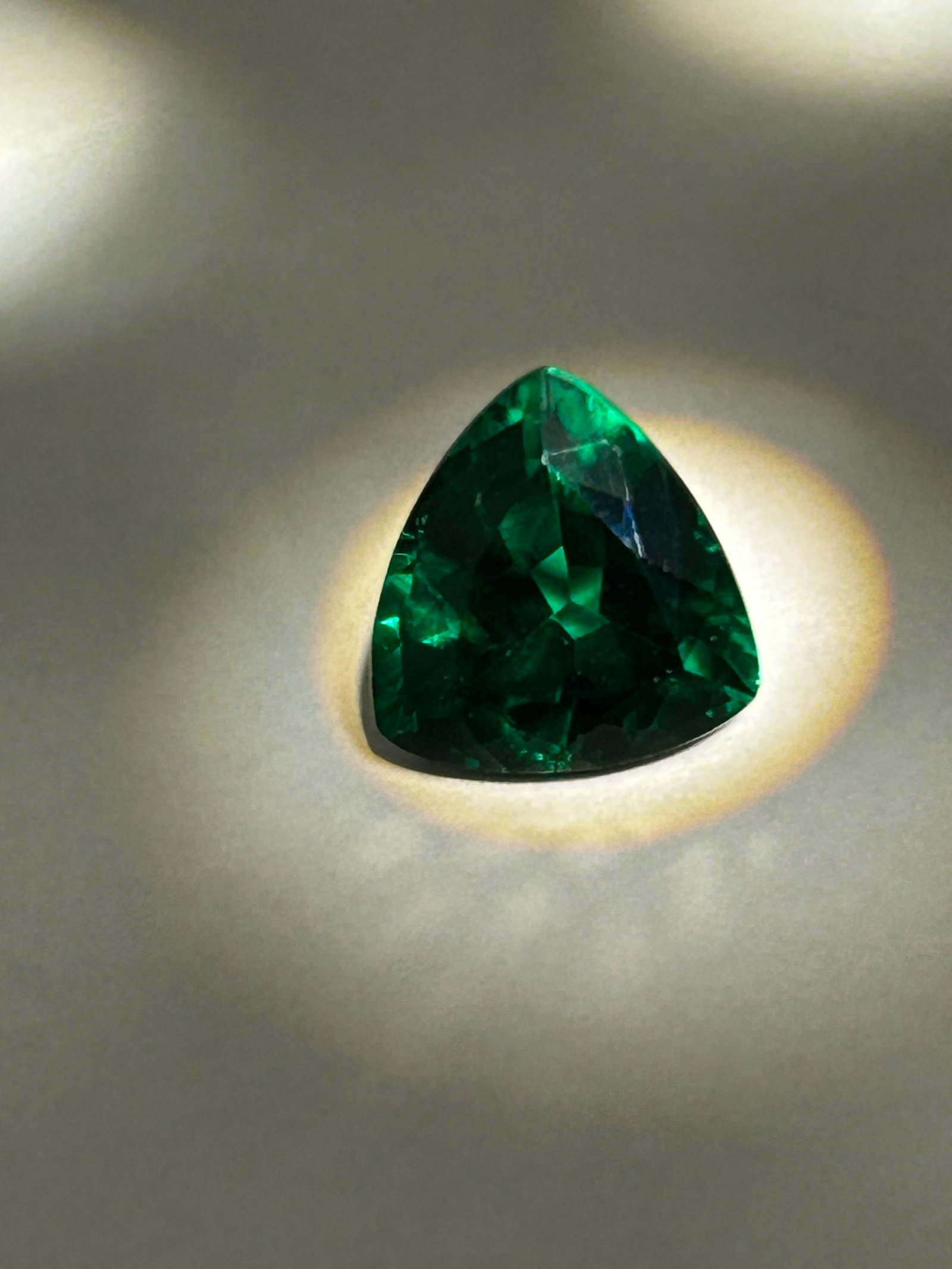 7 Carat --- Colombian Emerald ---- Cushion Cut ----European Gem Lab Certified: A striking, vivid green hue and an eye-catching, modern trillion cut. Its unique triangular shape offers a brilliant, fiery display of light, combining classic Colombian clarity with a contemporary ge