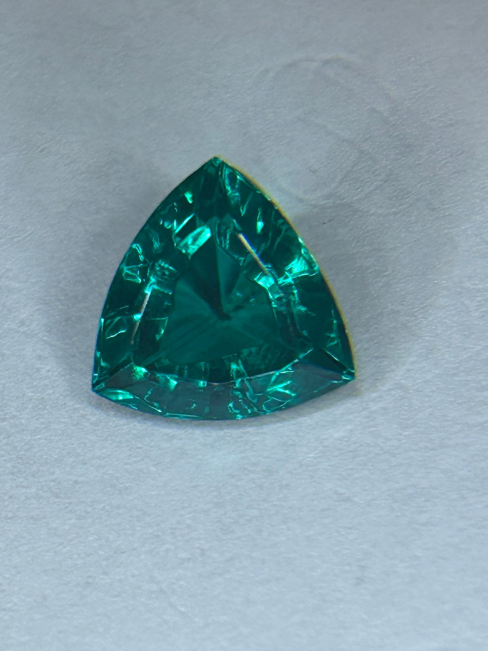 10.45 Carat ---- Stunning Natural Teal Blue Green Tourmaline ----Trillion Cut--GGL Certified: A significant gemstone, rich blue-green colors, originating from Brazil. It is characterized by its dramatic, triangular trillion cut, designed to maximize brilliance and fire.