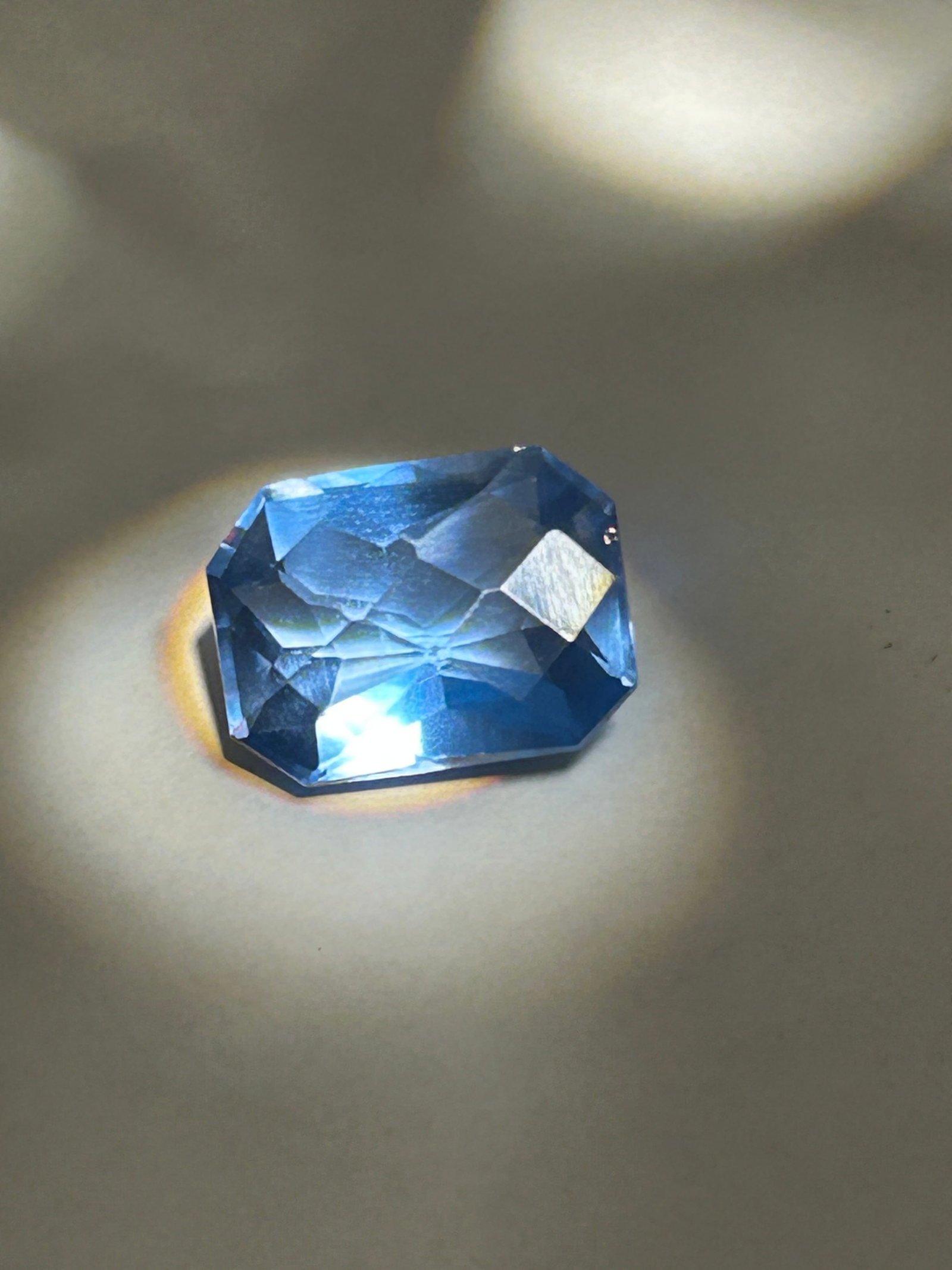 10.54 Carat -- Light Blue Spinel --- Rectangle Cut Corner Mixed Cut---IGI Certified: A highly sought-after gemstone. Cut into a rectangular shape with clipped corners, it features a mixed cut that maximizes both color saturation and brilliant light reflection. Originating from Ceylon,