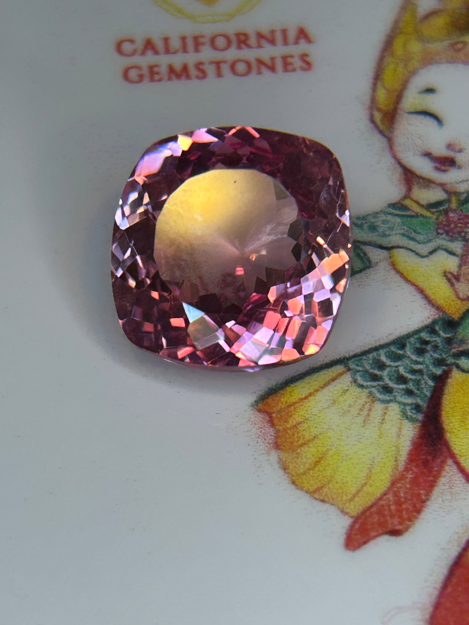 14.30 Carat ---- Padparadscha Sapphire ---- Cushion Mix Cut --- EGL Certified: A world-class gemstone. Combining delicate salmon-pink and sunset-orange hues, this stone features a cushion mix cut (a blend of brilliant and step cuts) that maximizes its fiery brilliance, paired wi