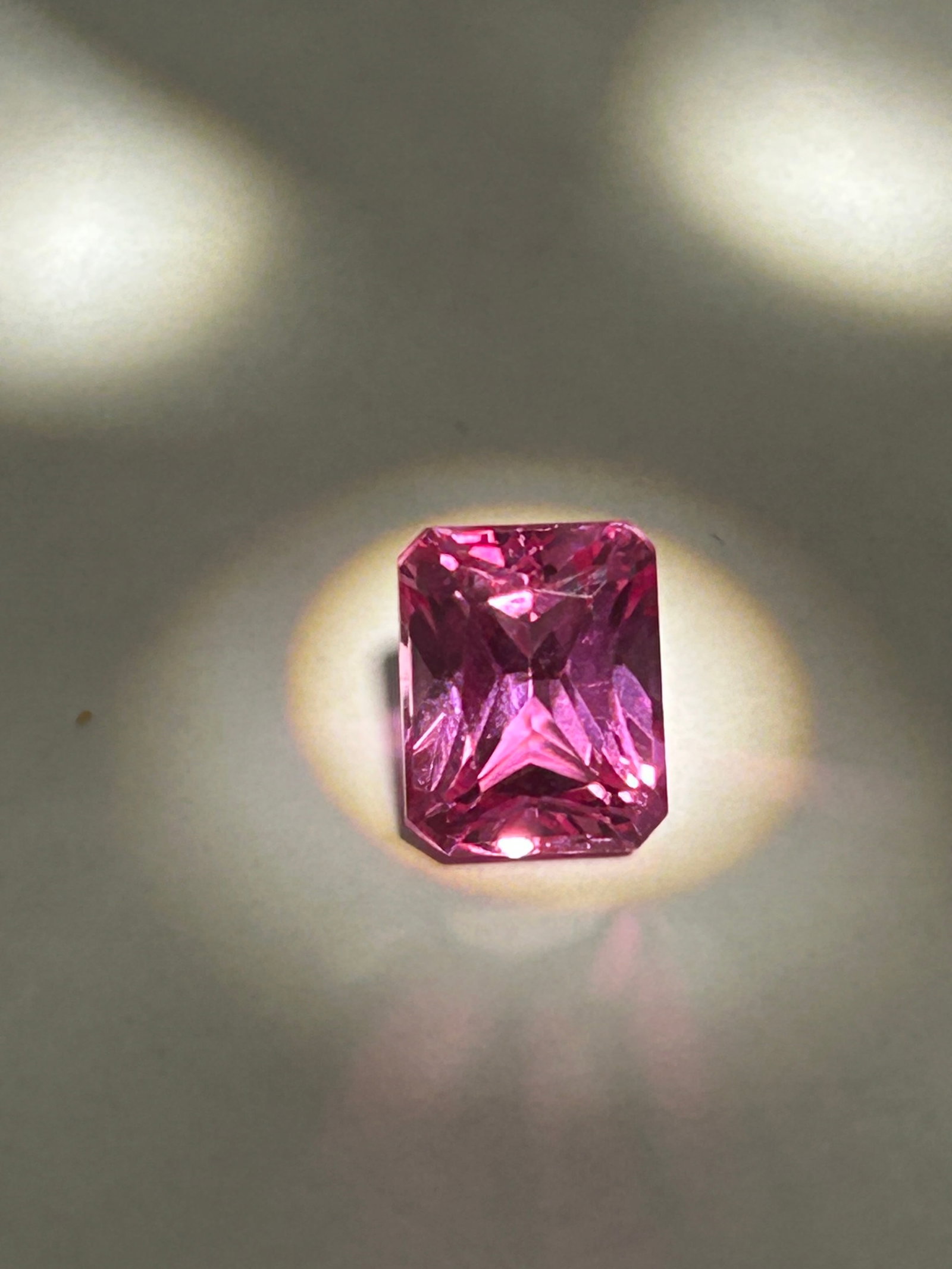 7.85 Carat --- Hot Pink Sapphire --- Emerald Step Cut----GGI Certified: Offering a sophisticated "hall-of-mirrors" effect. Often sourced from Sri Lanka and possessing high transparency, this substantial stone typically showcases a vibrant pink color, ideal for high-end, e