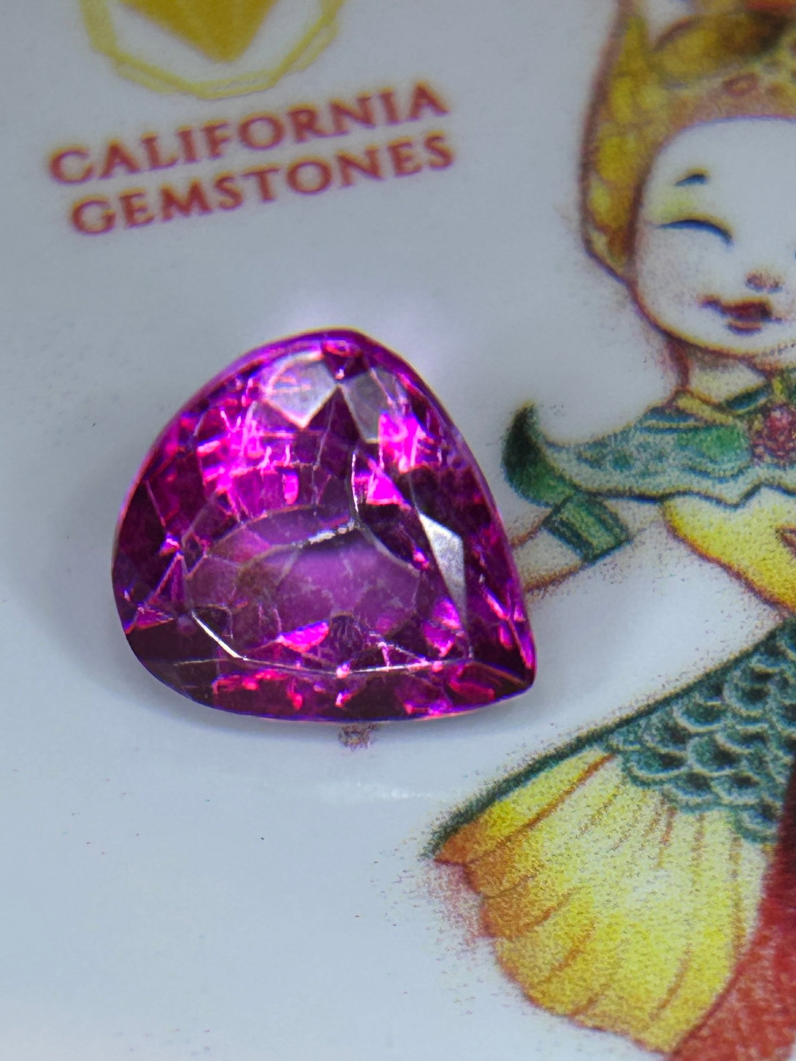7.55 Carat ---- Ceylon Pink Sapphire ---- Trillion Cut: Combining significant size with the vivid, magenta hues characteristic of Ceylon. Its trillion cut maximizes brilliance, making it a highly sought-after center stone for bespoke engagement rings or