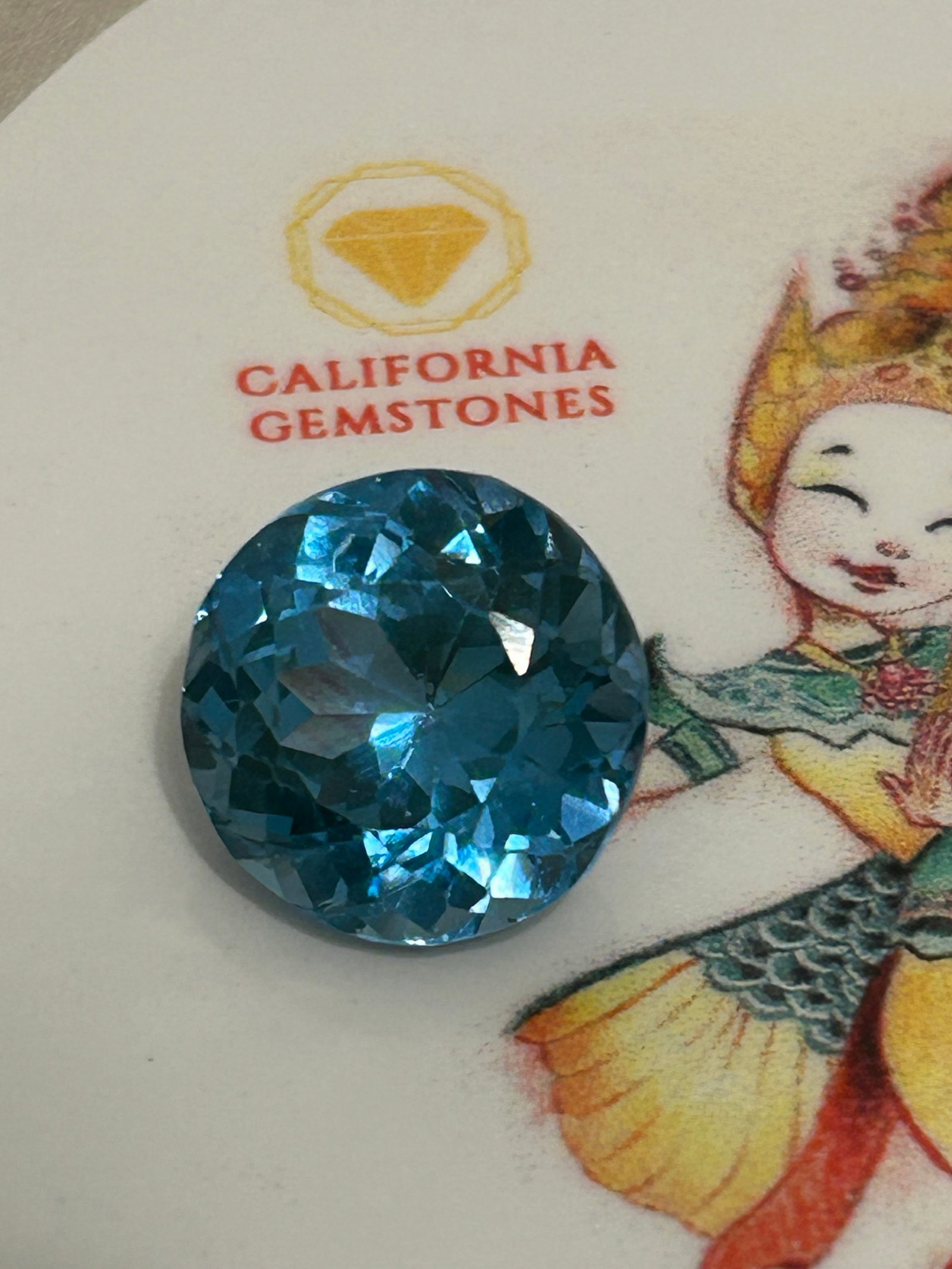 11.95 Carat Natural Brazilian Blue-Green Tourmaline Round Cut EGL Certified: Copper-Bearing Brazilian Paraíba Tourmaline. An exceptional and highly valuable gemstone. Stones of this size and color belong to the prestigious Paraíba variety, celebrated worldwide for its vibran