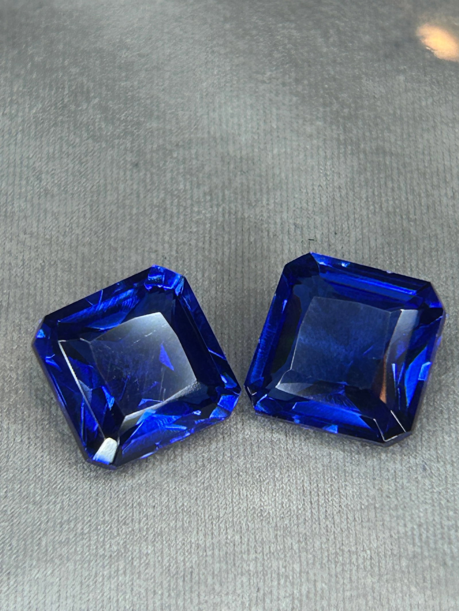 14.80 Carat -- Natural Blue Sapphire PAIR - Radiant Cut--- GGI Certified: Two large, high-quality radiant cut stones requires precision, this combination typically features rich blue coloration and excellent brilliance for high-end jewelry like drop earrings or a statement 