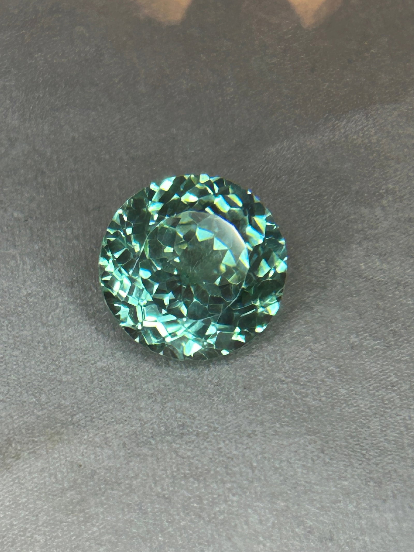 9.55 Carat ---- Natural Mozambique Blue Green Tourmaline ----Round Cut ----AGL Certified: A remarkably large, rare, and eye-catching gemstone. Mozambique is world-renowned for producing tourmalines—including the highly coveted copper-bearing Paraíba variety—that exhibit vivid, highly 