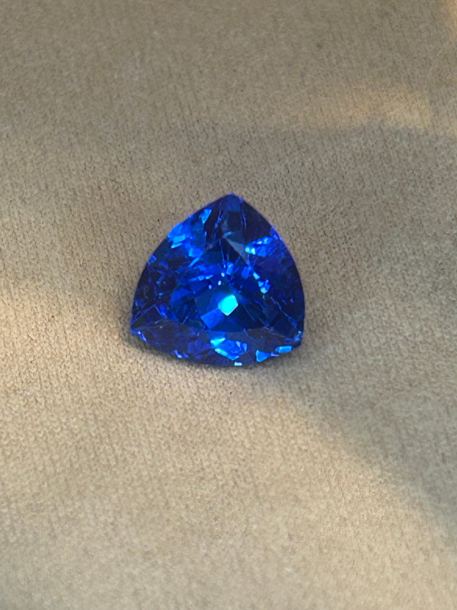 5.90 Carat--- Natural Tanzanite --- Trillion Cut ---- AGL Certified: a rare, large, triangular gemstone displaying vibrant blue-violet colors. It features modern geometric brilliance, strong pleochroism, and high collector value.