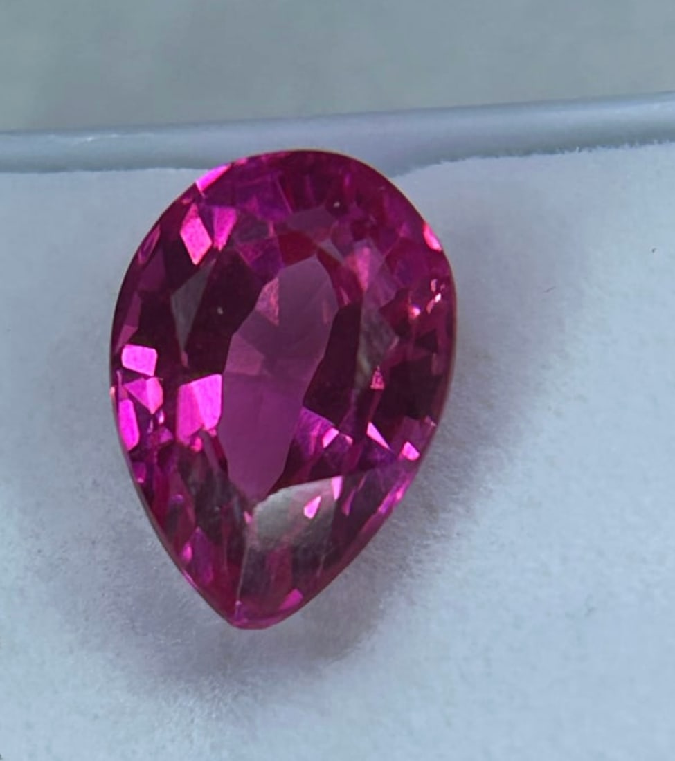 4.50 Carat --- Natural Ceylon Pink Sapphire --- Pear Cut --- GGI Certified: A high-value, pear-cut gemstone originating from Sri Lanka, featuring a vibrant, intense pink or purplish-pink hue. Renowned for exceptional clarity and brilliance, making them highly desirable for co
