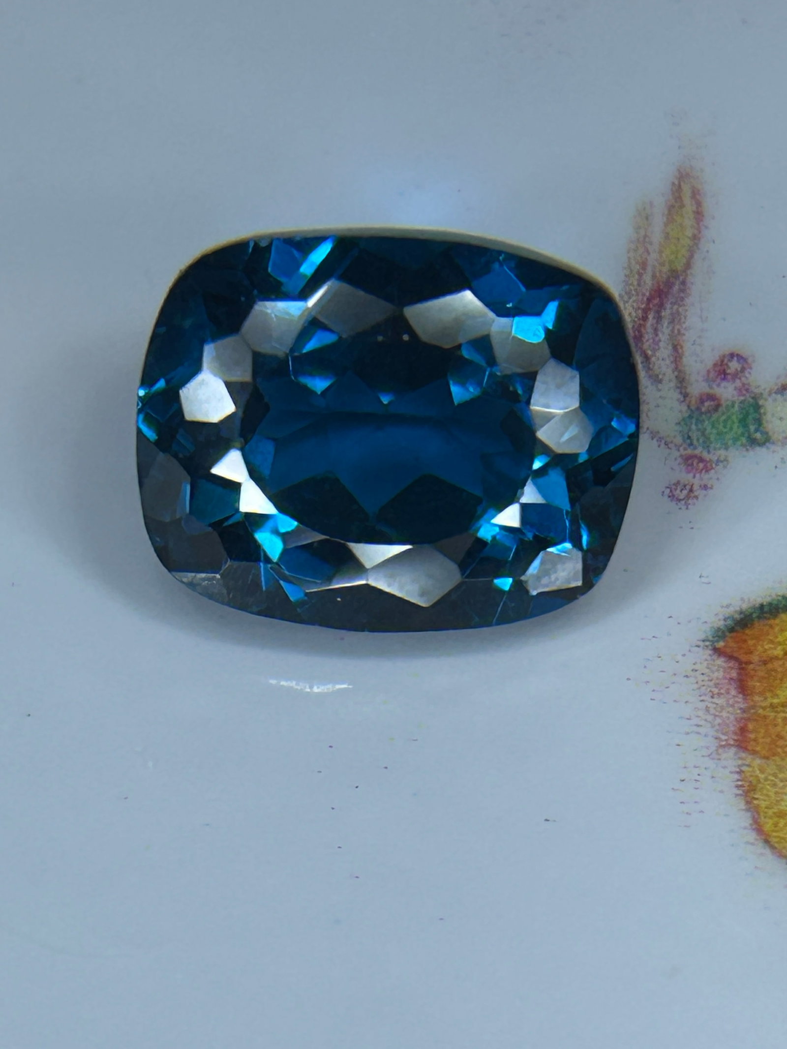 7.55 Carat ---- Natural Namibian Blue Sapphire ---- Mixed Oval Cushion Cut - AGL Certified: a mixed oval cushion cut is a rare, high-value corundum gemstone combining an elongated oval footprint with the soft, rounded corners of a cushion shape.