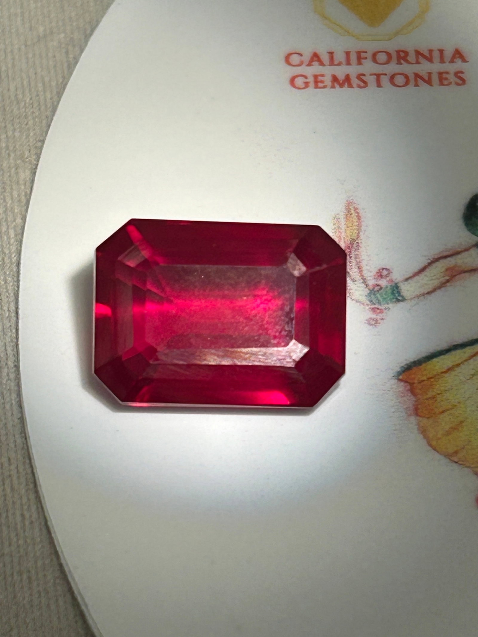 11 Carat ---- Natural Burmese Blood Ruby ---- Emerald Step Cut: An exceptional, luxury gemstone featuring a deep crimson hue, linear step facets, and premium collector value.