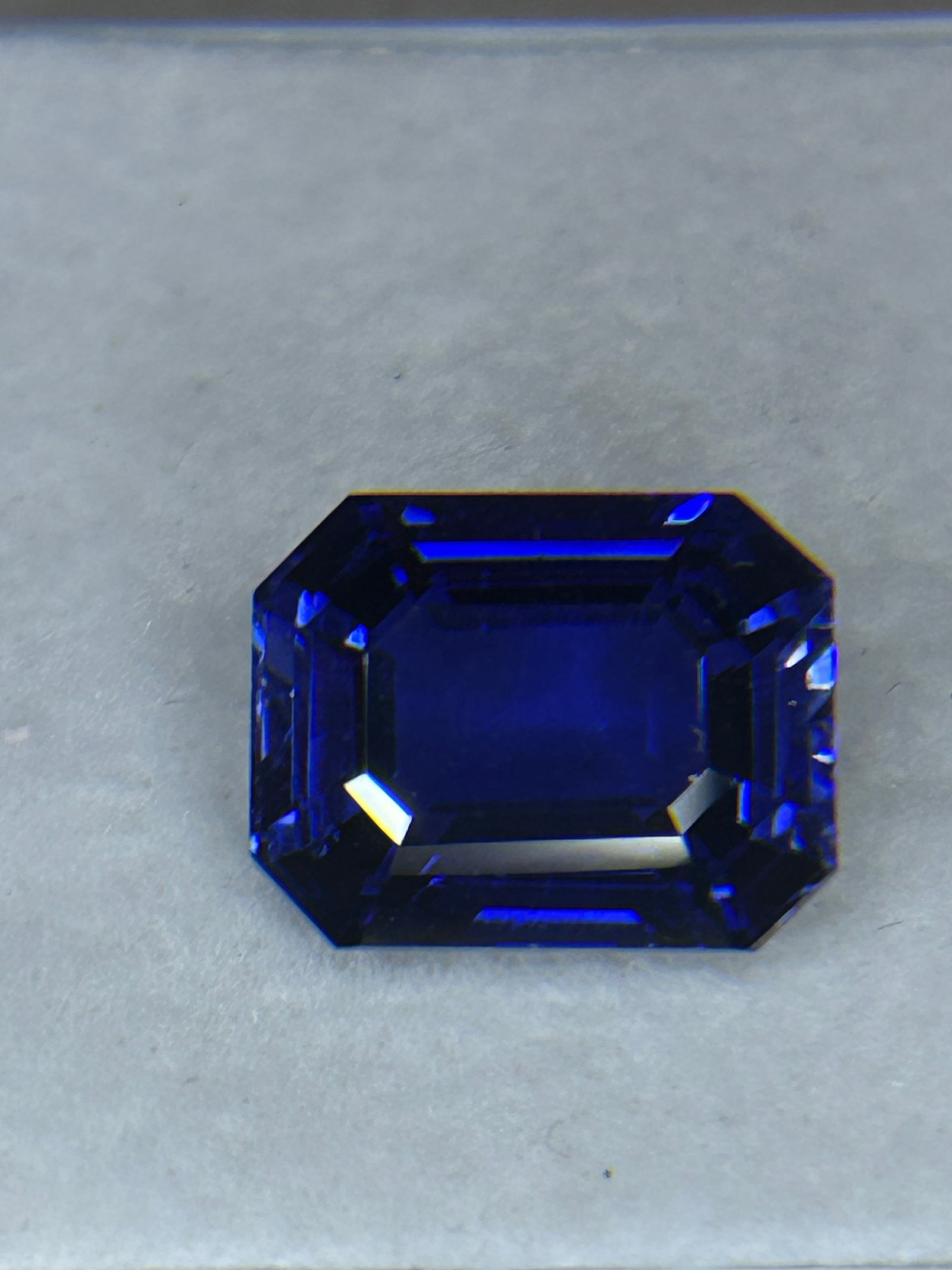 12.9 Carat --Natural Blue Sapphire--- Emerald Step Cut --- GIR Certified: A premium loose gemstone. It features parallel step facets that emphasize deep, transparent blue color and high clarity rather than maximum fiery sparkle. High-end specimen.