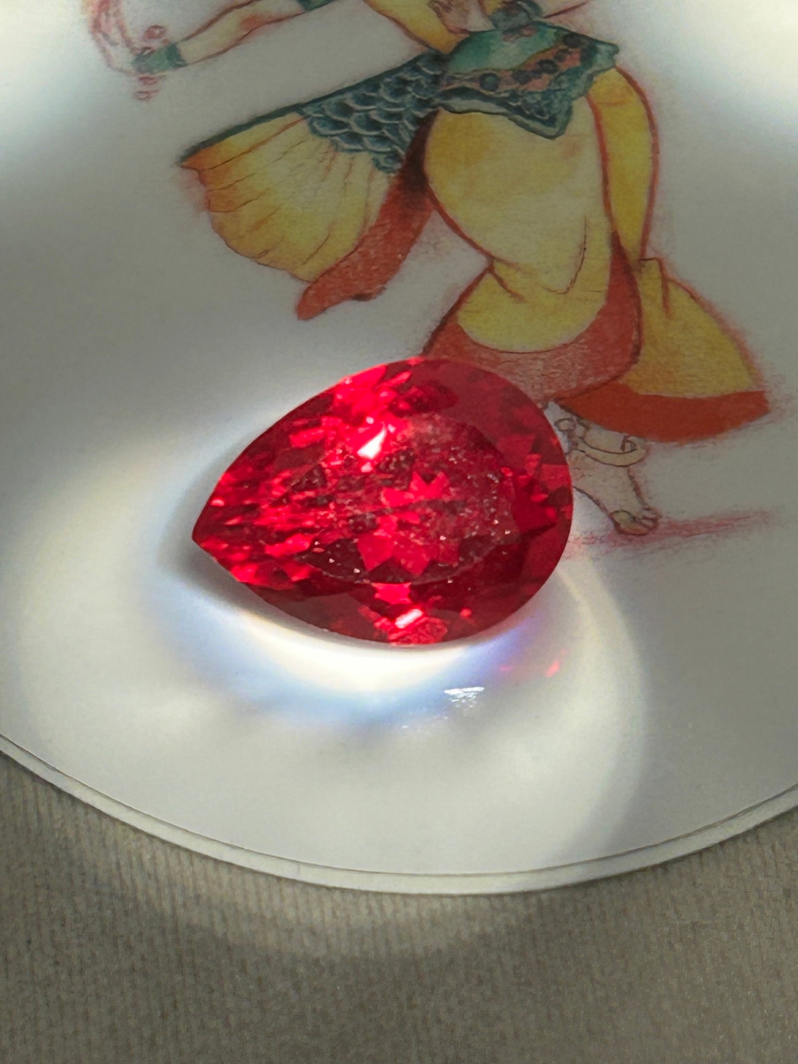 10 Carat Natural Burmese Ruby Pear Cut: A natural Burmese ruby with a pear cut is an exceptionally rare, high-value gemstone. It features a teardrop shape blending a round end and a sharp point, characteristic soft-red fluorescent glow from
