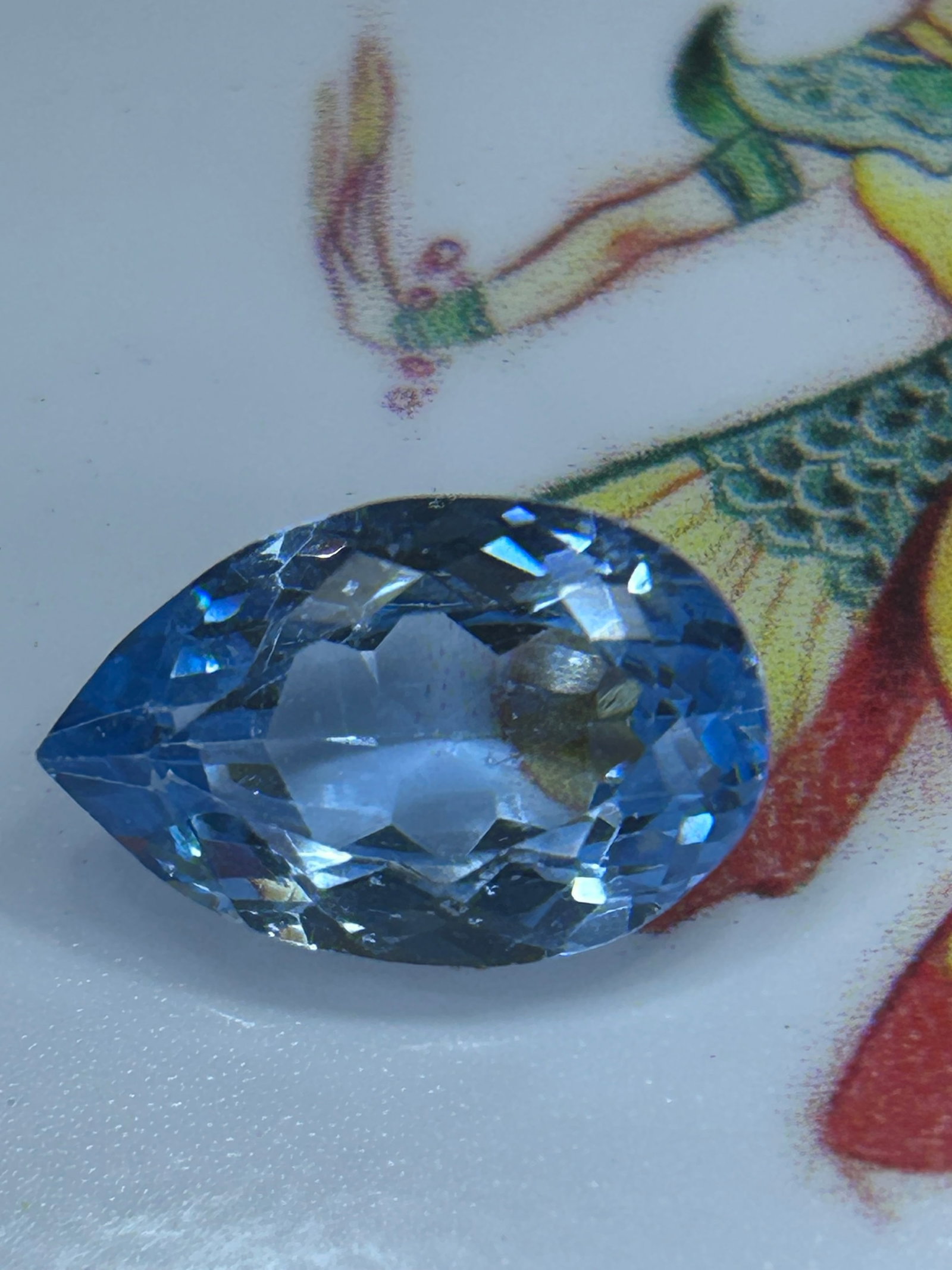7.00 Carat Natural Brazilian Blue Tourmaline Brilliant Pear Cut: Paraíba tourmaline, a high-end indicolite featuring a sky blue hue, high transparency, and teardrop faceting designed to maximize sparkle.