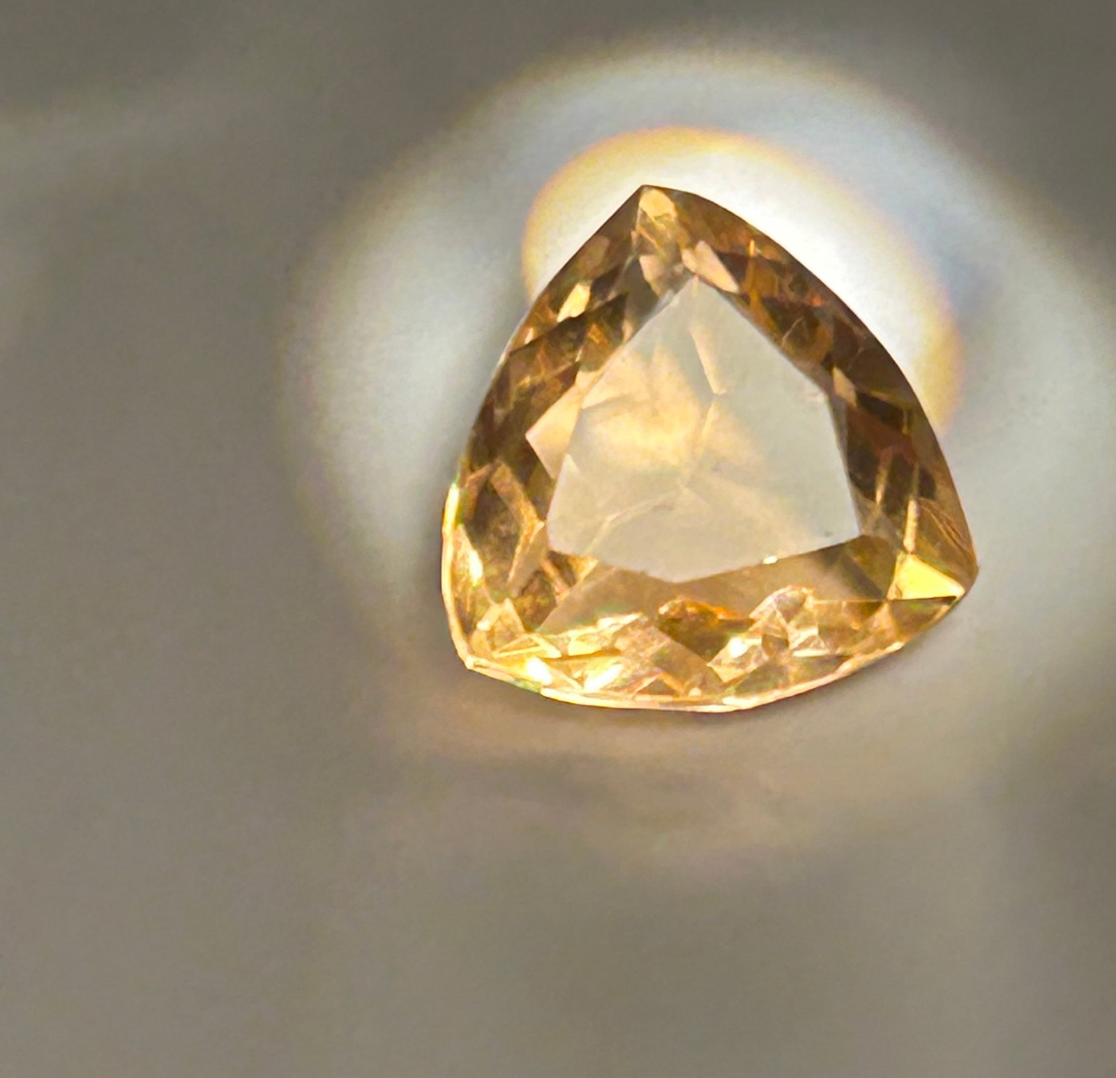 9.00 Carat --- Natural Brazilian Imperial Topaz--- Trillion Cut: A trillion-cut topaz is an eye-catching gemstone, typically used as a center stone for statement jewelry. This stone is a natural golden-yellow Imperial Topaz, sourced from Brazil.