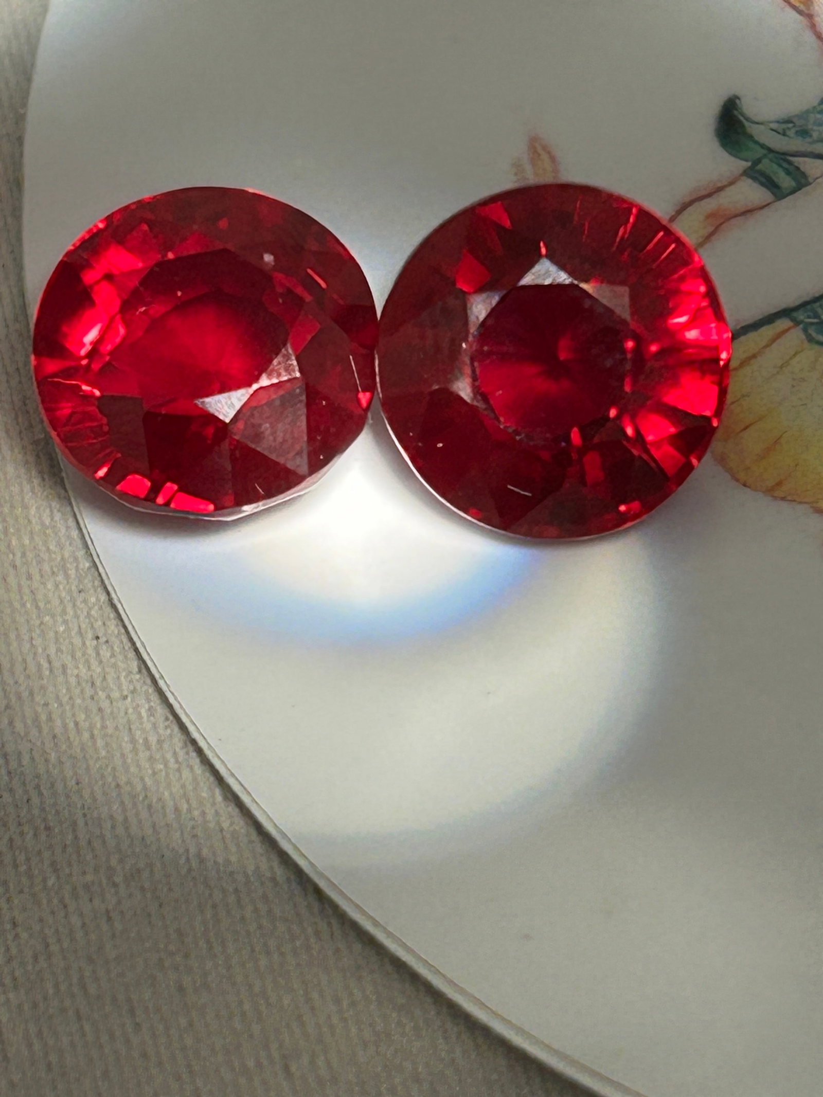 19.40 Carat Sparkling Myanmar Red Ruby Brilliant Round Cut: An exceptional 19.40 carat natural red ruby pair are a masterpiece of nature, originating from the legendary mines of Myanmar (Burma). Displaying an intense, vibrant saturation and a highly coveted br