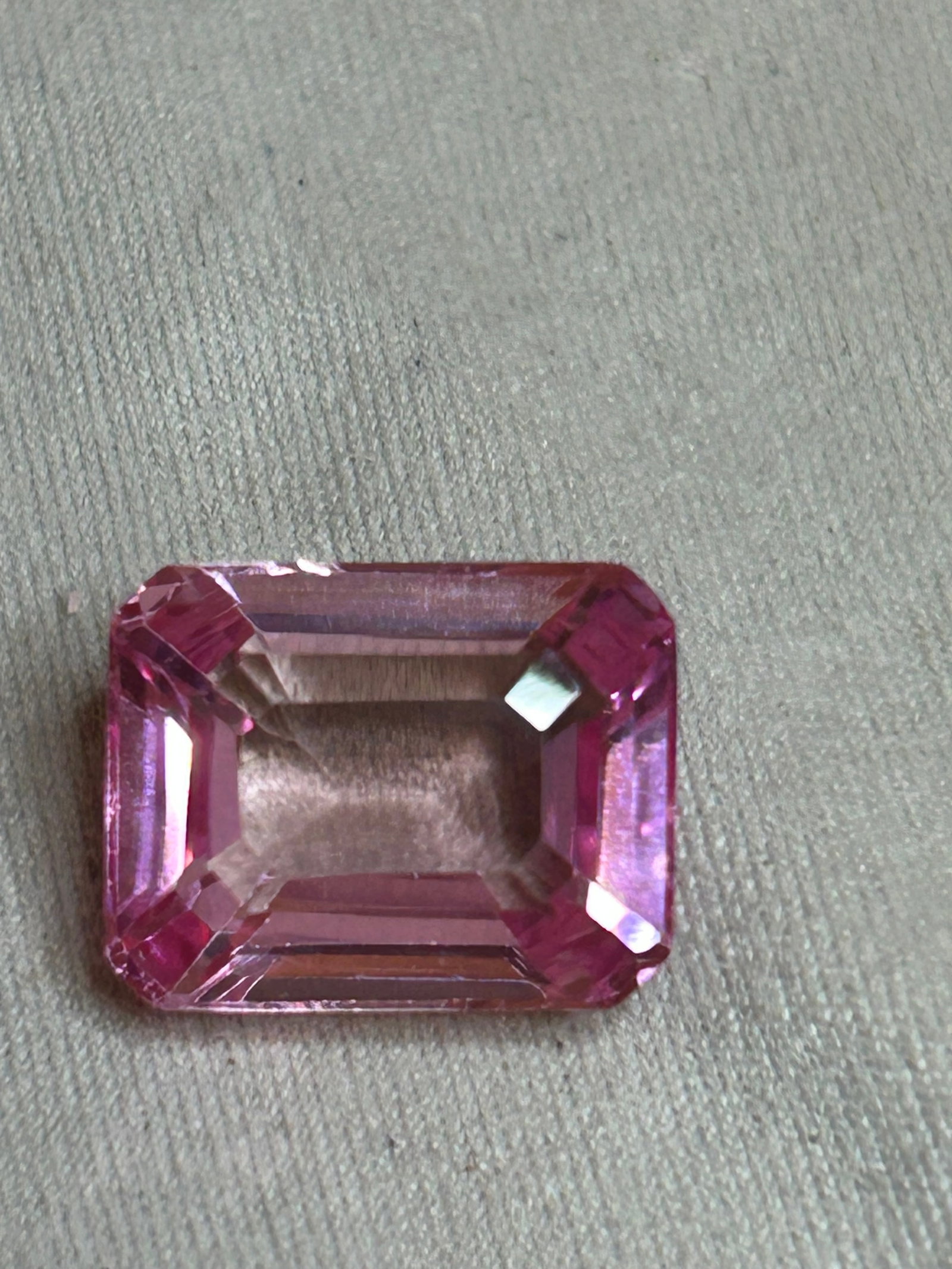 8 Carat Pink Sapphire Emerald Step Cut: a vibrant, electric blue color paired with geometric step facets that create a striking "hall-of-mirrors" optical effect. Step cuts emphasize clarity and linear reflections rather than fiery sparkle.