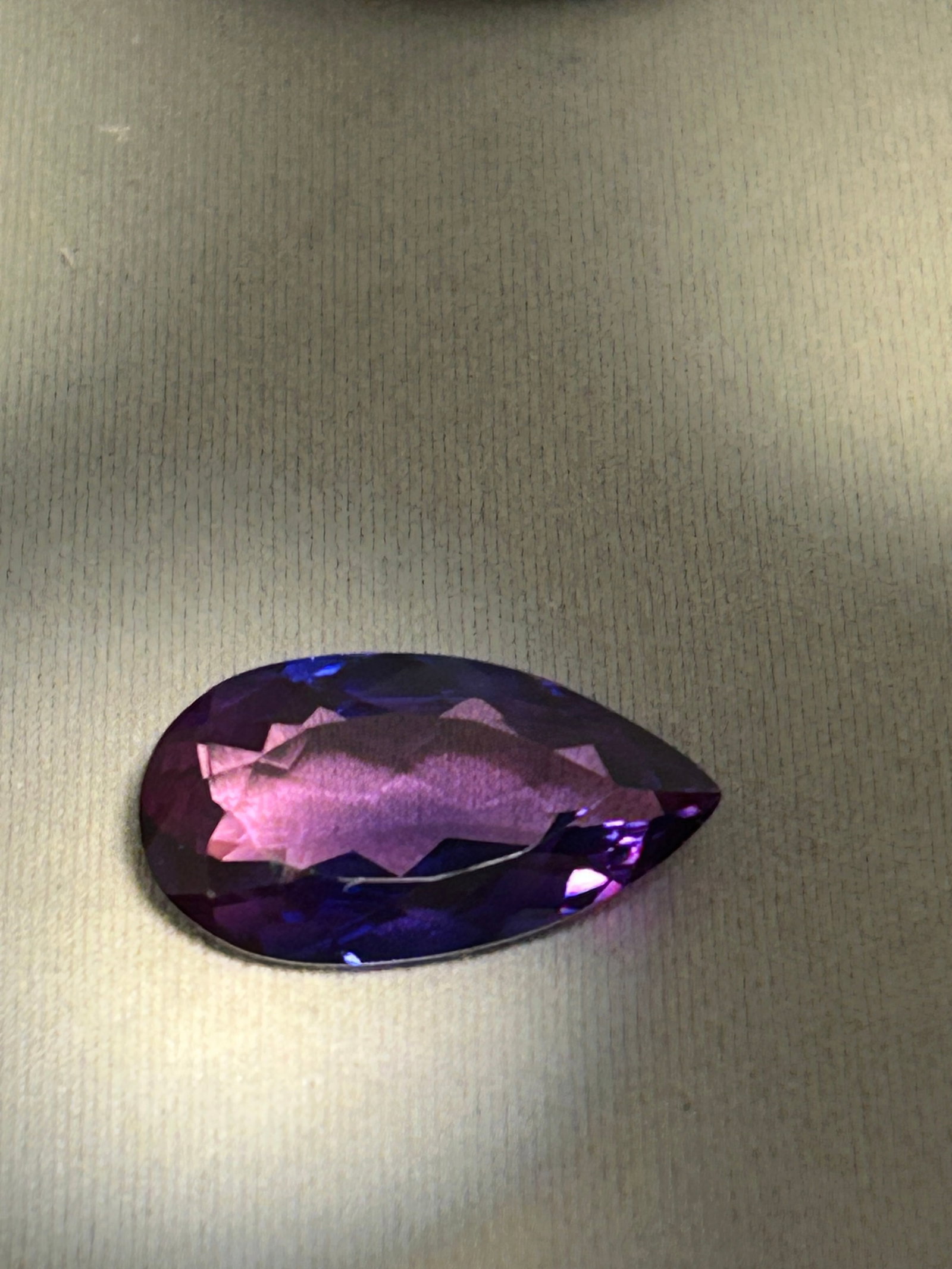 9.85 Carat Purple Tanzanite Pear Cut: An exceptionally, investment-grade collector’s gemstone. Tanzanite is exclusively mined in the Merelani Hills of Tanzania, making a single stone of nearly 10 carats a highly coveted find due to its